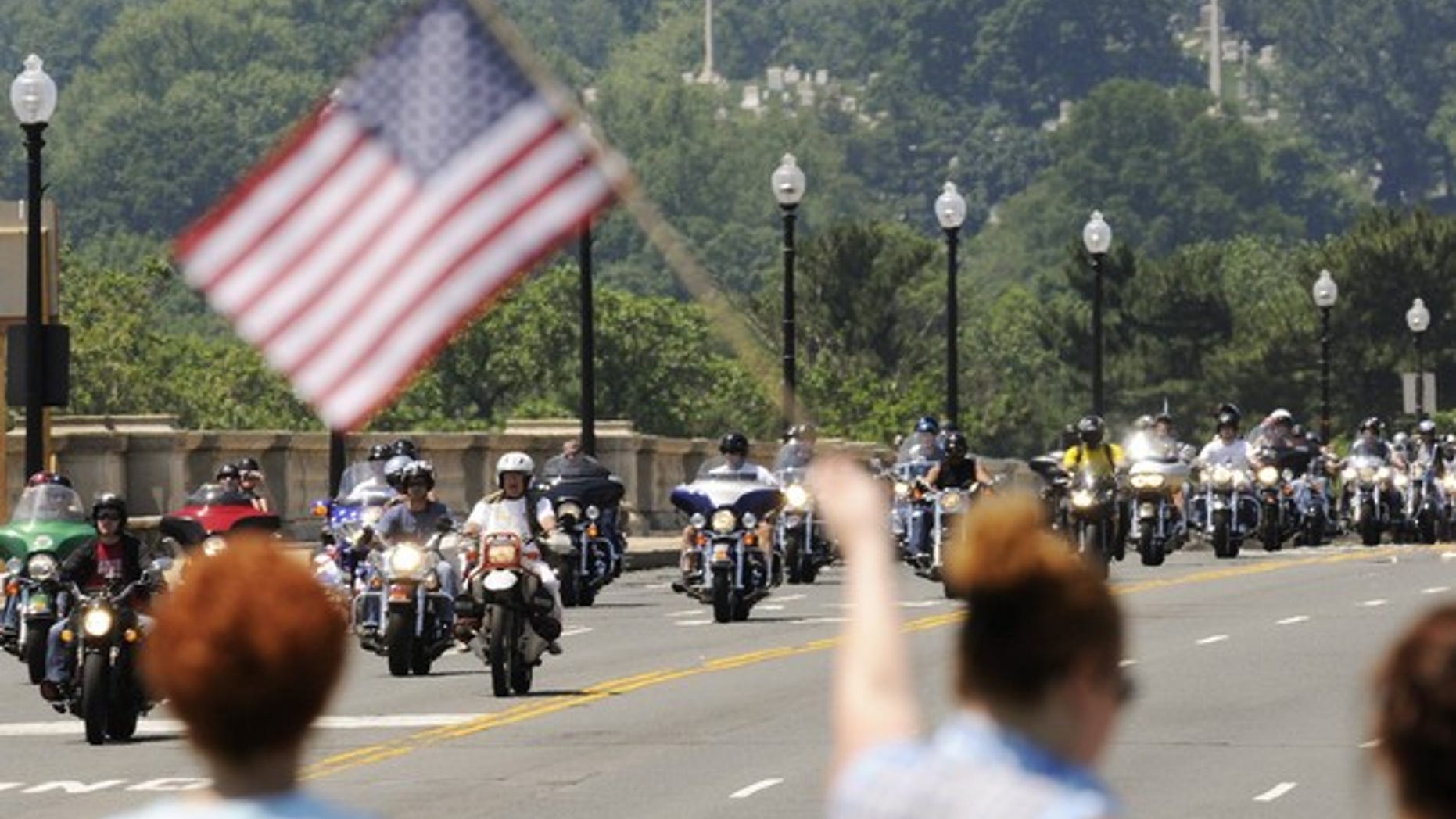 Motorcycle riders take part in the annual Rolling Thunder demonstration, crossing the Memorial Bridge in front of Arlington Cemetery to pay their respects at the Vietnam Veterans Memorial in Washington, May 30, 2010. (Reuters)
