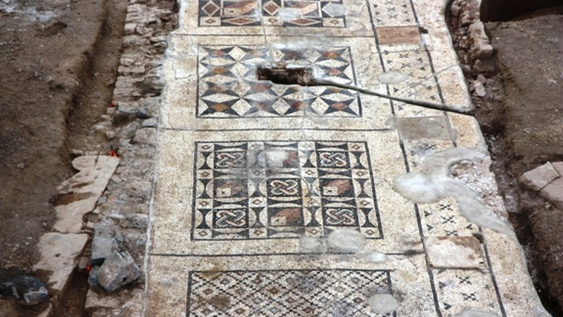 Each section of the mosaic features its own geometric design.