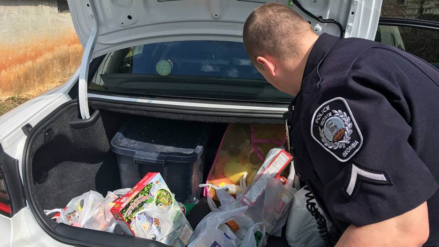 Two Rome, GA police officers bought over $50 worth of groceries for a teen caught shoplifting.