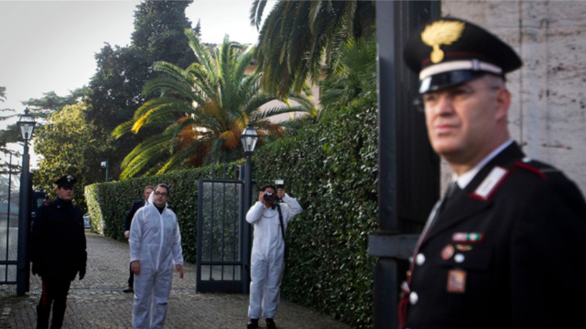 Dec. 23: Forensic and Carabinier police officers inspect the area inside the Swiss Embassy in Rome. A package exploded Thursday at the Swiss Embassy in Rome, wounding one person, police said. The Foreign Ministry called it a "deplorable act of violence'' against the Swiss. The explosion occurred when the package was opened by an embassy staffer, who was wounded and subsequently taken to the hospital, said a spokesman at the carabinieri police in Rome. (AP)