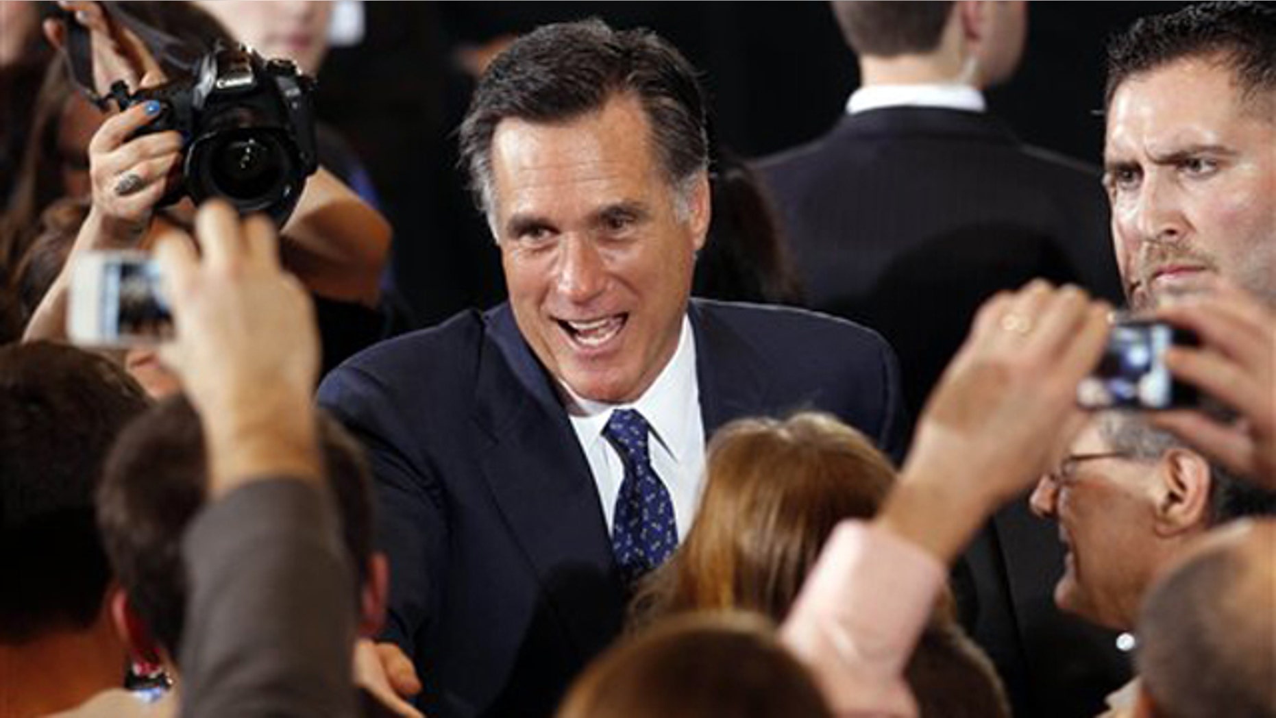 Feb. 28, 2012: Mitt Romney greets supporters at his election watch party after winning the Michigan primary in Novi, Mich.