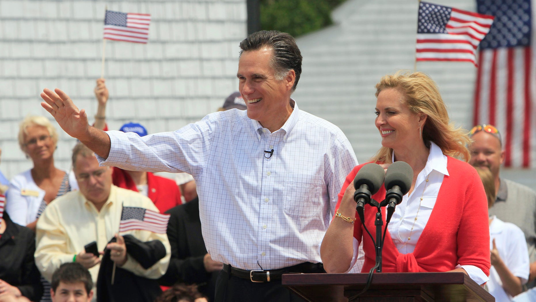 Former Massachusetts Gov. Mitt Romney, accompanied by his wife Ann, arrives to announce his 2012 candidacy for president, Thursday, June 2, 2011, in Stratham, N.H. (AP)