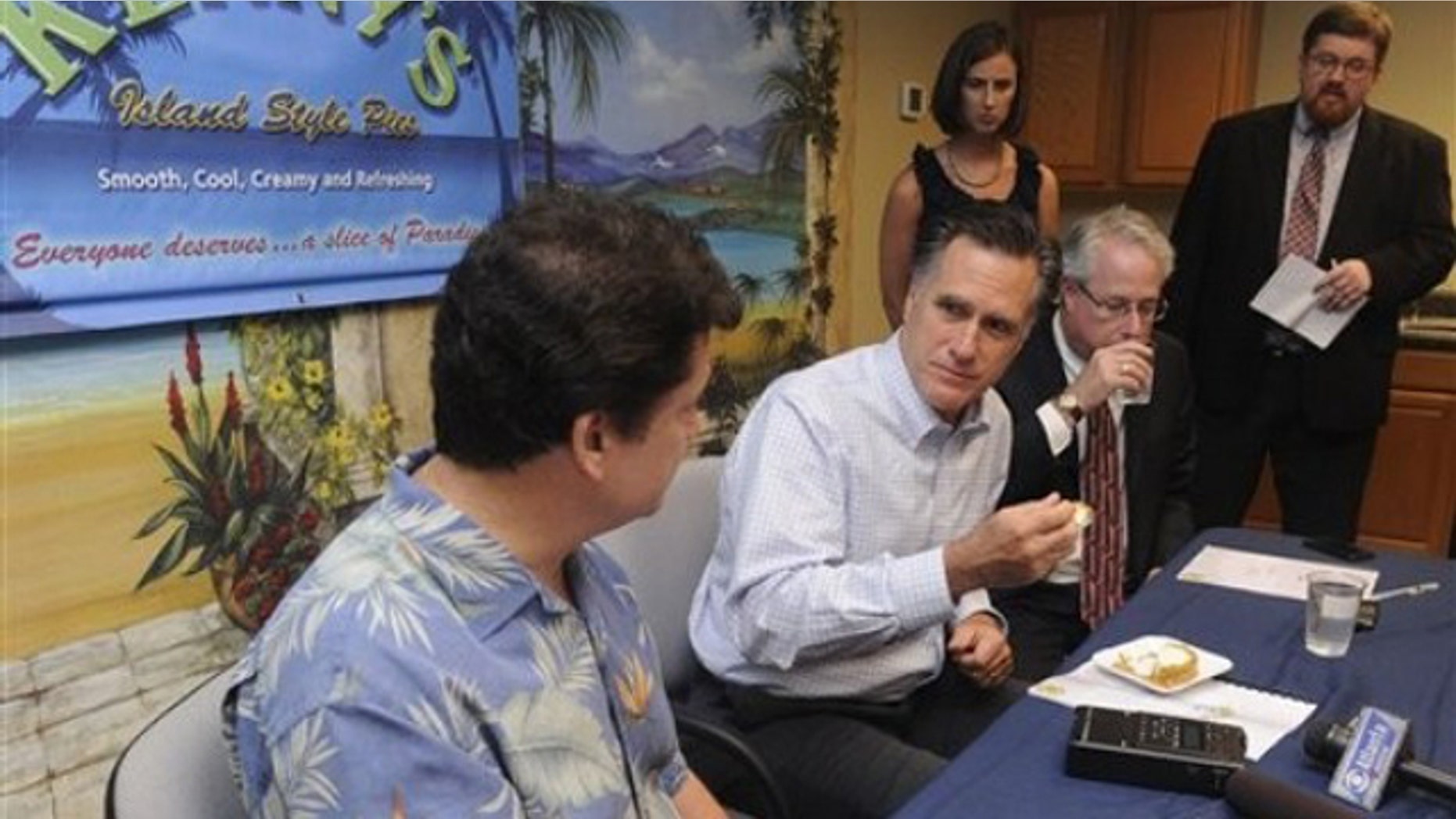 Thursday: Republican presidential hopeful, former Mass. Gov. Mitt Romney, takes a bite of pie while talking to Kenny Burts, left, owner of the small Georgia business Kenny's Great Pies in Smyrna.