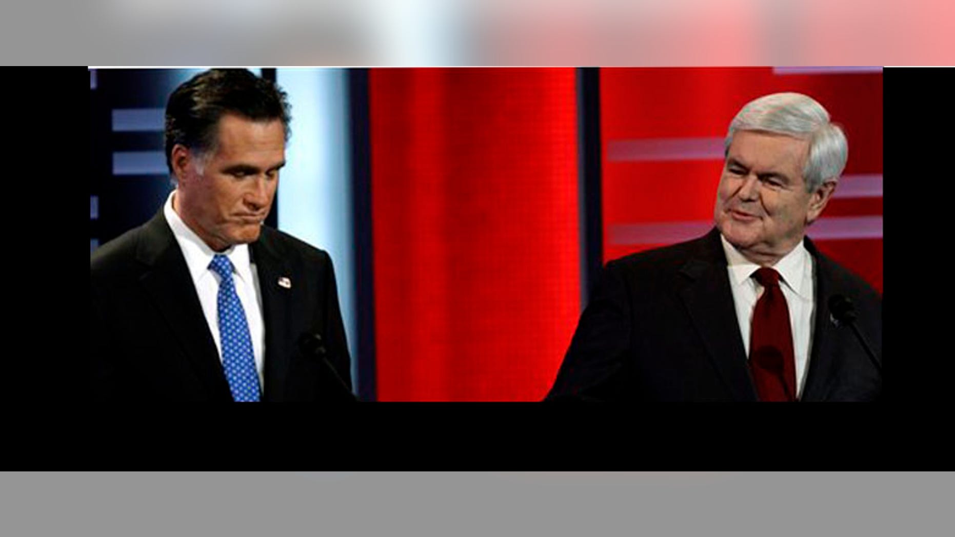 Los aspirantes a la candidatura presidencial republicana Mitt Romney, izq., y Newt Gingrich durante el debate republicano el 10 de diciembre del 2011 en Des Moines, Iowa (AP Foto/Charlie Neibergall)