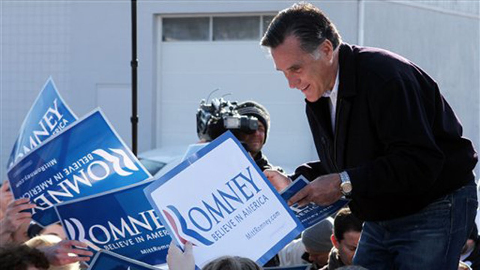 Dec. 3, 2011: Mitt Romney speaks to supporters and volunteers during a rally in Manchester, N.H.