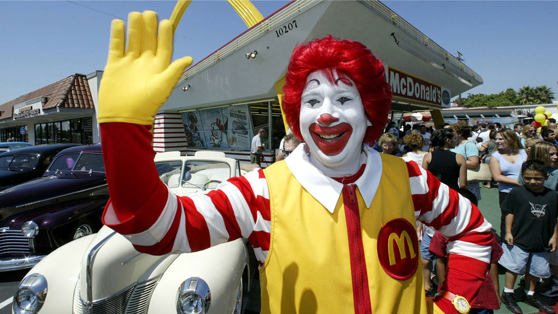 Several men dressed as Ronald McDonald mobbed the Burger King "for a laugh," says a witness.