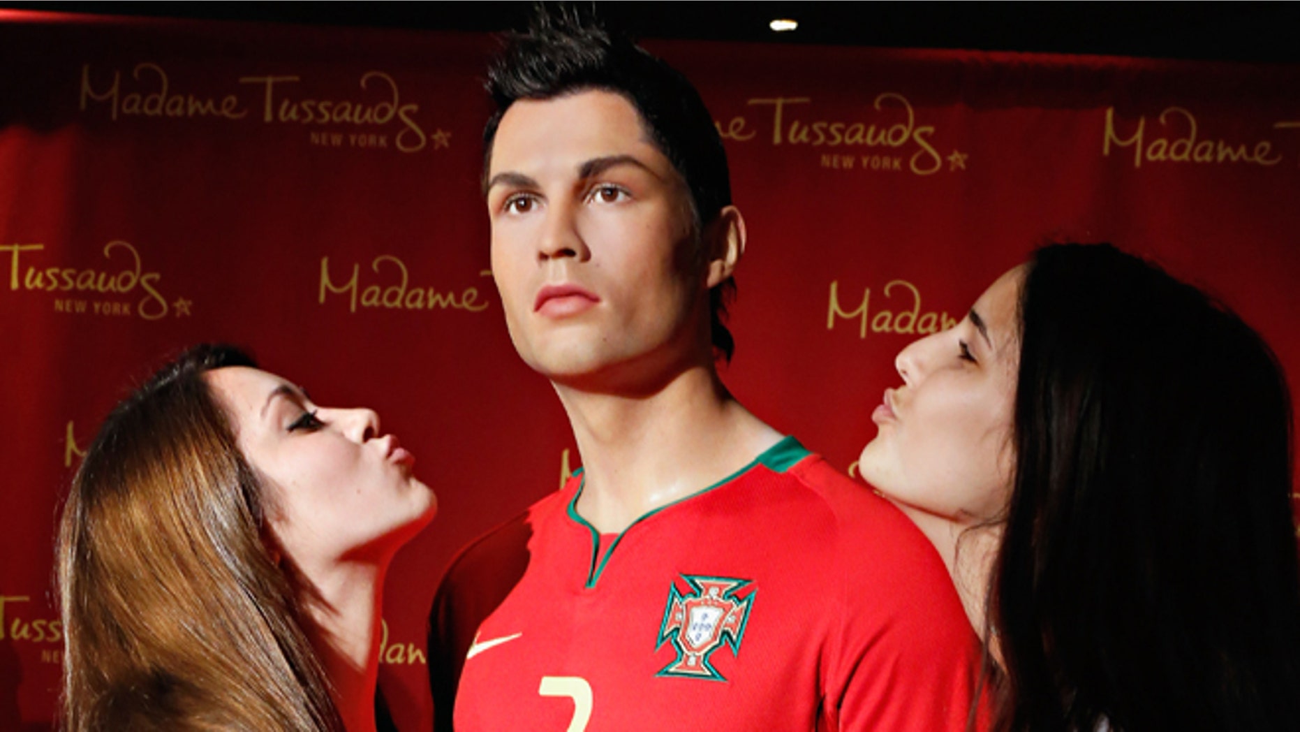 Fans get close to the Cristiano Ronaldo wax figure at Madame Tussauds in New York City. (Photo by Cindy Ord/Getty Images for Madame Tussauds New York)