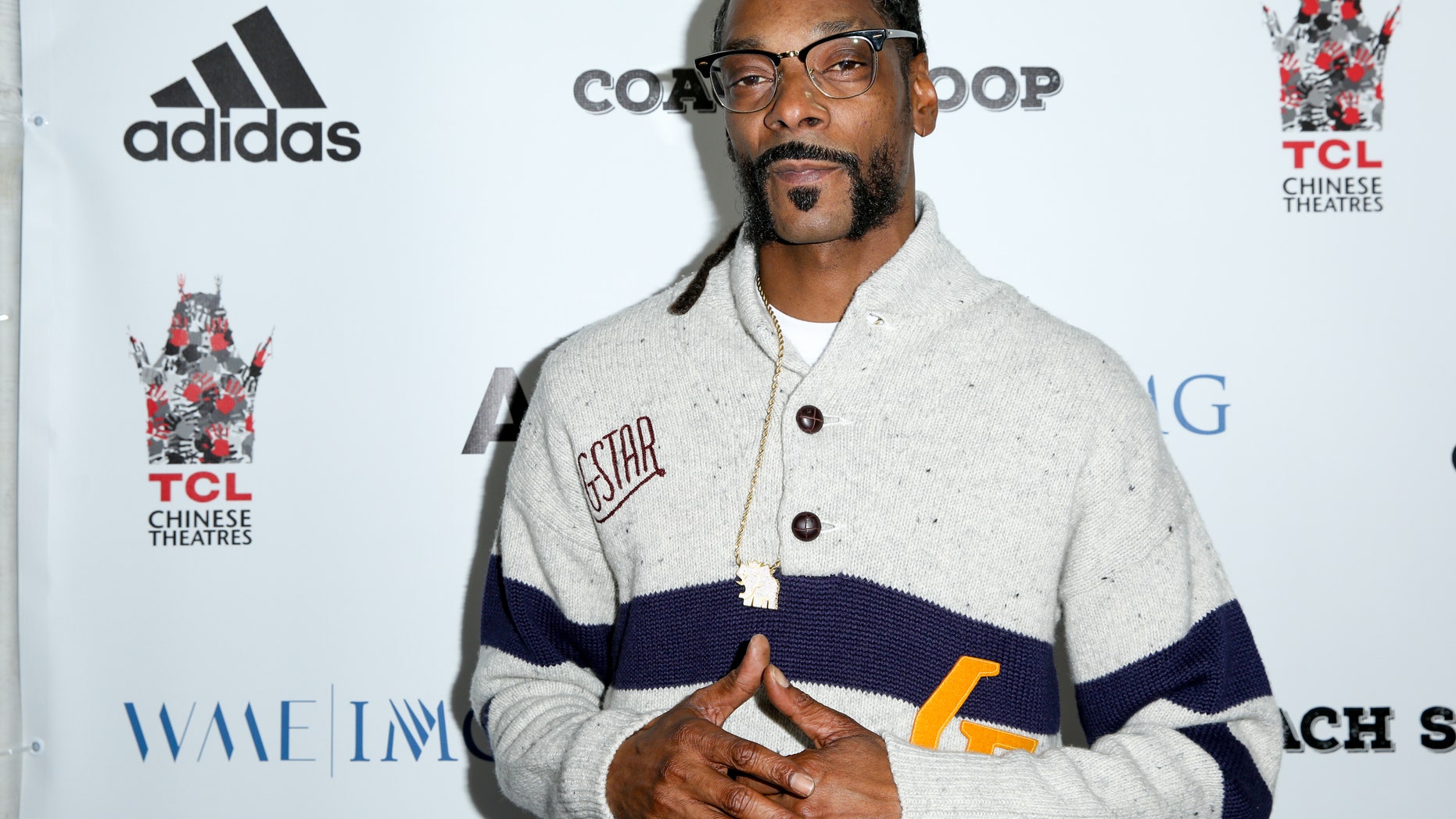 FILE - In this, May 16, 2016, file photo, Snoop Dogg arrives at the LA Premiere of "Coach Snoop" at the TCL Chinese 6 Theatres in Los Angeles. Snoop Dogg called for a boycott of the History Channel's "Roots" remake in an Instagram post on May 30, 2016. (Photo by Rich Fury/Invision/AP, File)