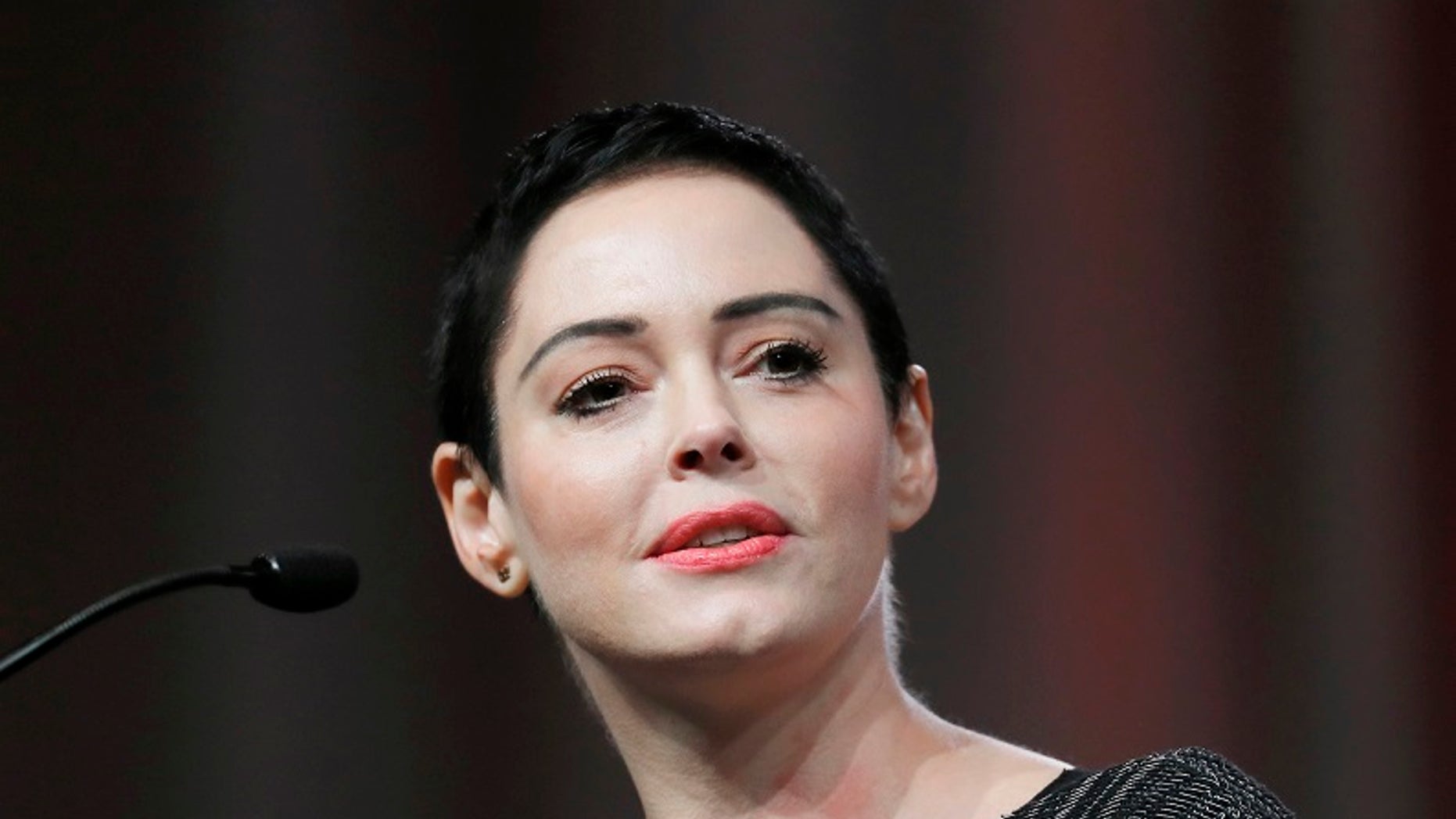 FILE- In this Oct. 27, 2017, file photo, actress Rose McGowan speaks at the inaugural Women's Convention in Detroit. McGowan spoke to TV critics Tuesday about her upcoming documentary series "Citizen Rose" and what she called her global struggle against sexual assault and economic injustice. She has been privately taping her life for several years, joining with Bunim-Murrary Productions to create the documentary series. (AP Photo/Paul Sancya, File)
