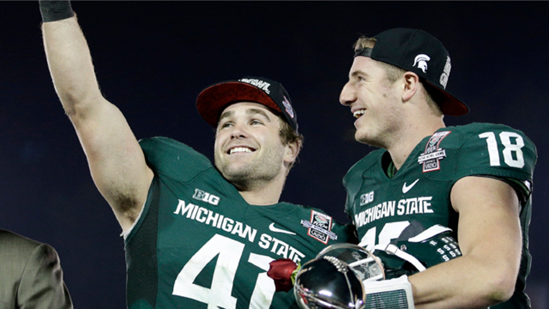 Jan. 1, 2014: Michigan State linebacker Kyler Elsworth, left, celebrates with quarterback Connor Cook after Michigan State defeated Stanford 24-20 in the Rose Bowl NCAA college football game.