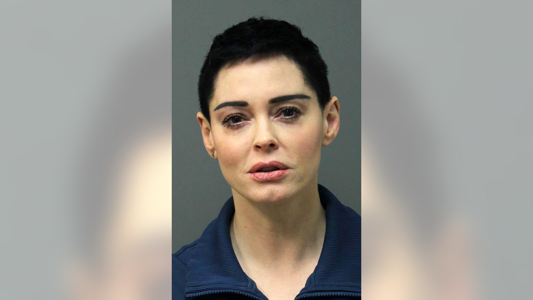 This image released Tuesday, Nov. 14, 2017 by the Loudoun County Sheriff's Office shows the booking photo for actress Rose McGowan who surrendered to Airports Authority Police on charges of possession of a controlled substance. The felony charge stems from a police investigation of personal belongings left behind on a Jan. 20 flight that arrived at Washington Dulles International Airport in Virginia. Police say the items tested positive for narcotics. (Loudoun County Sheriff's Office via AP)