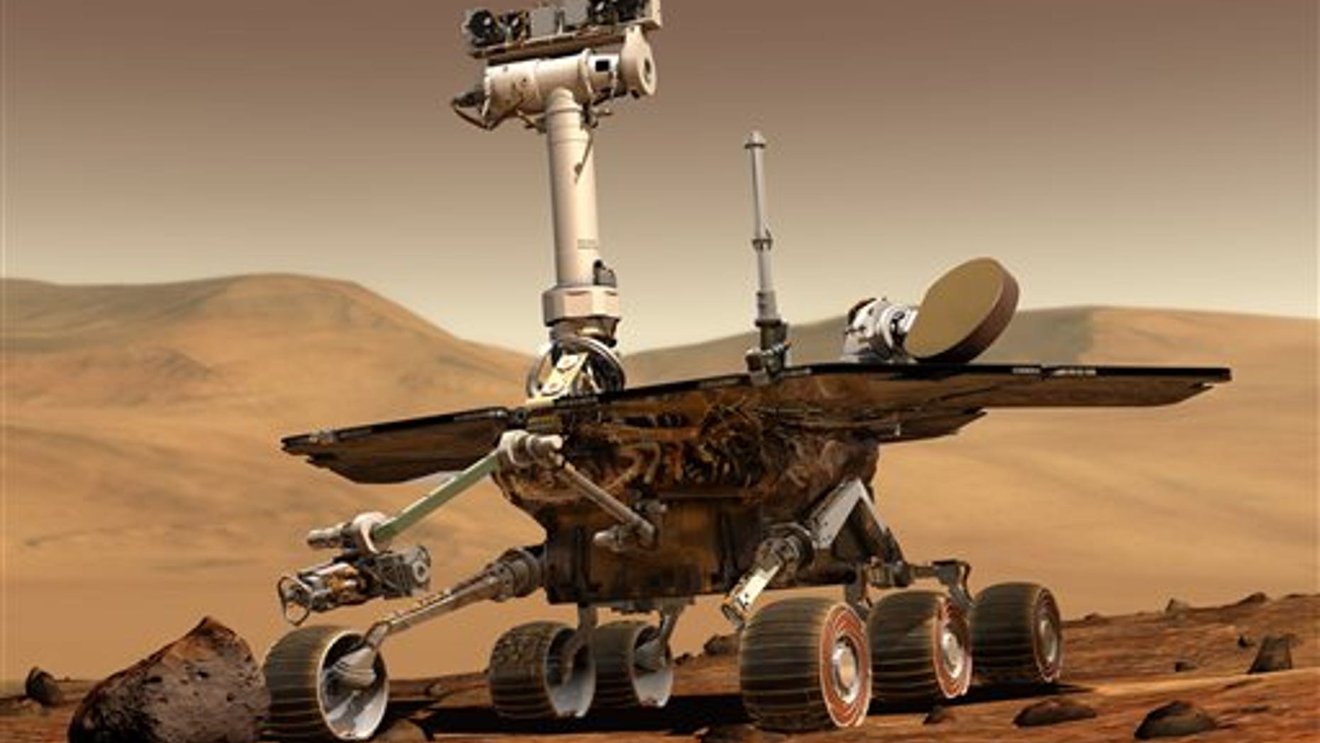 This artist rendering released by NASA shows the NASA rover Opportunity on the surface of Mars. Opportunity landed on the red planet on Jan. 24, 2004 and is still exploring. Its twin Spirit stopped communicating in 2010. (AP Photo/NASA)