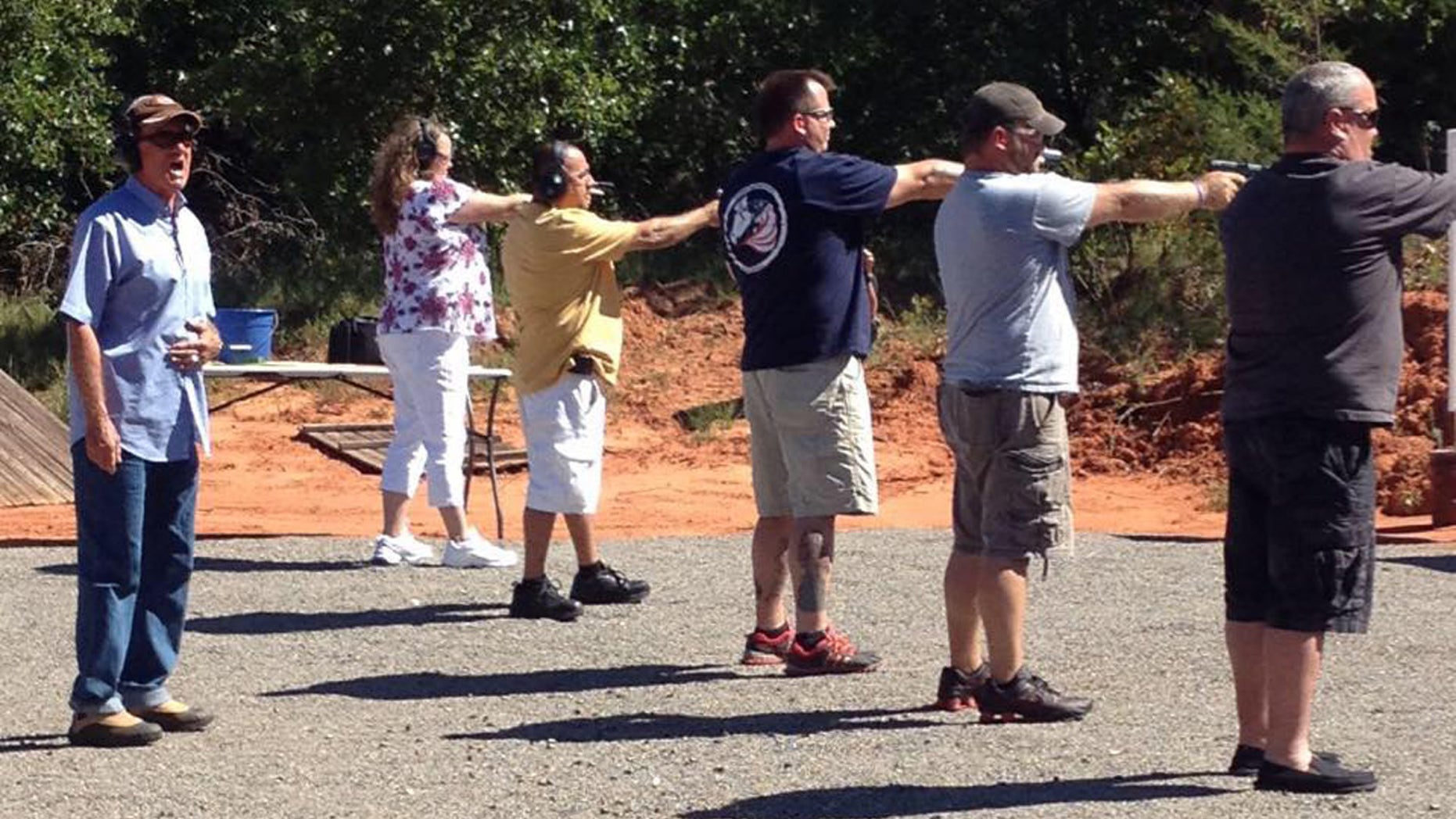 Concealed weapons instructor Roy Jones with students on his shooting range in Oklahoma.
