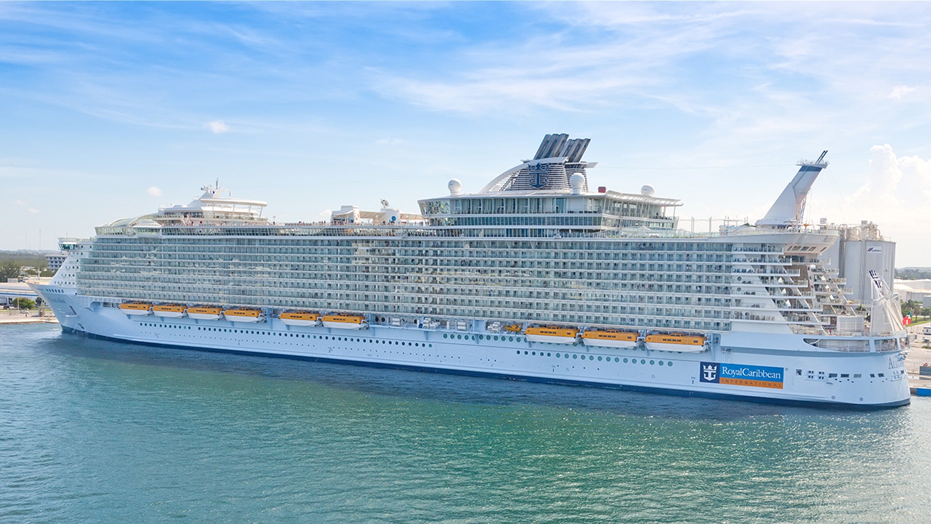 "Ft. Lauderdale, Florida, USA - July 10, 2011: Royal Caribbean's, Allure of the Seas, docked in Port Everglades. The Allure of the Seas holds the record for the largest passenger ship ever constructed, just 2.0 in. longer than her sister ship, Oasis of the Seas."