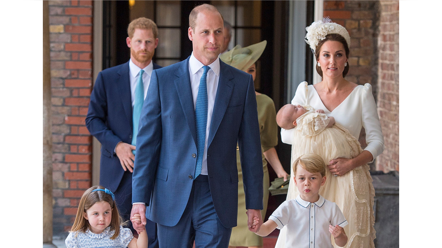 Princess Charlotte and Prince George hold the hands of their father Prince William while Kate, Duchess of Cambridge holds Prince Louis as they arrive for his christening service at the Chapel Royal, St James's Palace, London, Monday, July 9, 2018. (Dominic Lipinski/Pool Photo via AP)