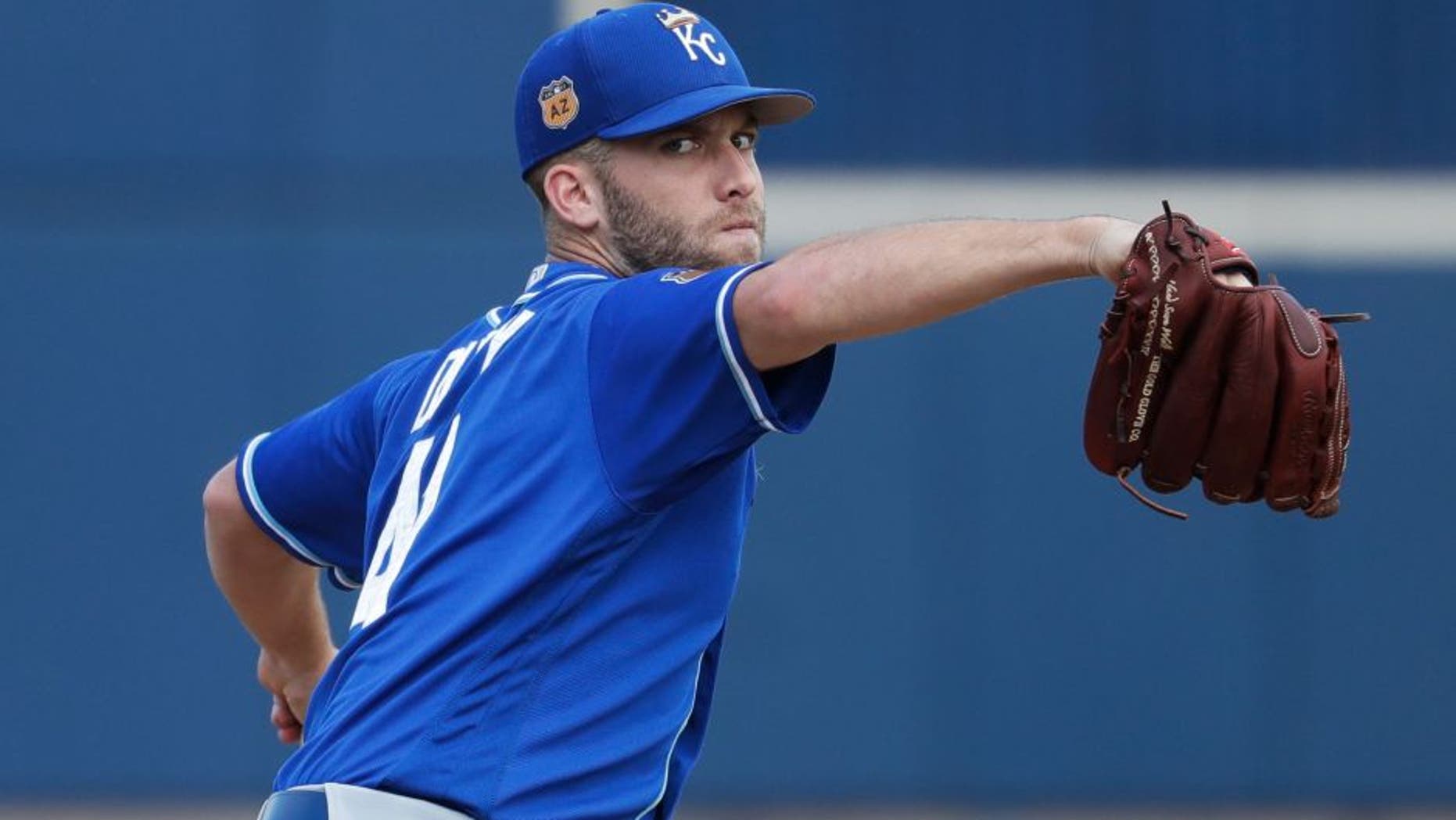Kansas City Royals' Danny Duffy throws before the first inning of a spring training baseball game against the Milwaukee Brewers Tuesday, Feb. 28, 2017, in Phoenix. (AP Photo/Morry Gash)