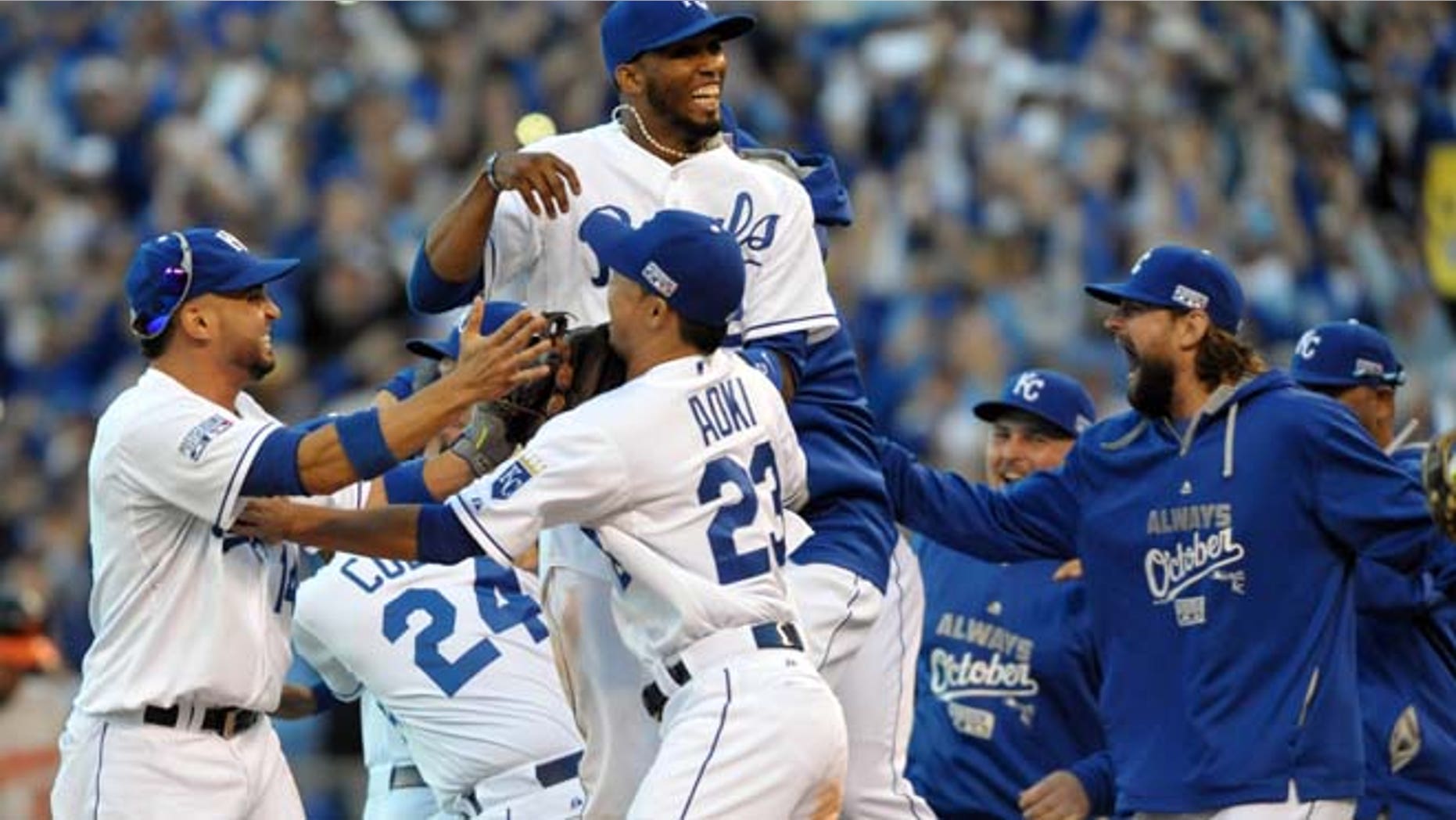 Oct 15, 2014: Kansas City Royals players celebrate on the field after defeating the Baltimore Orioles in game four of the 2014 ALCS playoff baseball game at Kauffman Stadium.