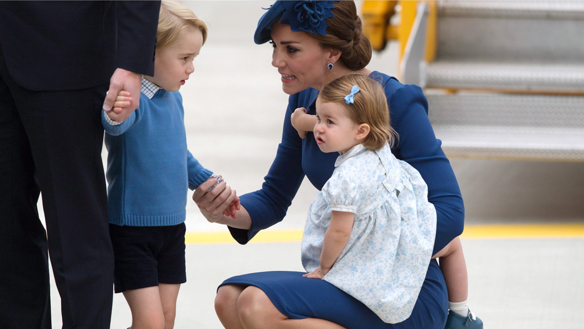 Sept. 24, 2016: Kate, the Duchess of Cambridge, holds her daughter Princess Charlotte as she speaks to her son Prince George as she and her husband Britain's Prince William, the Duke of Cambridge, arrive in Victoria, British Columbia.
