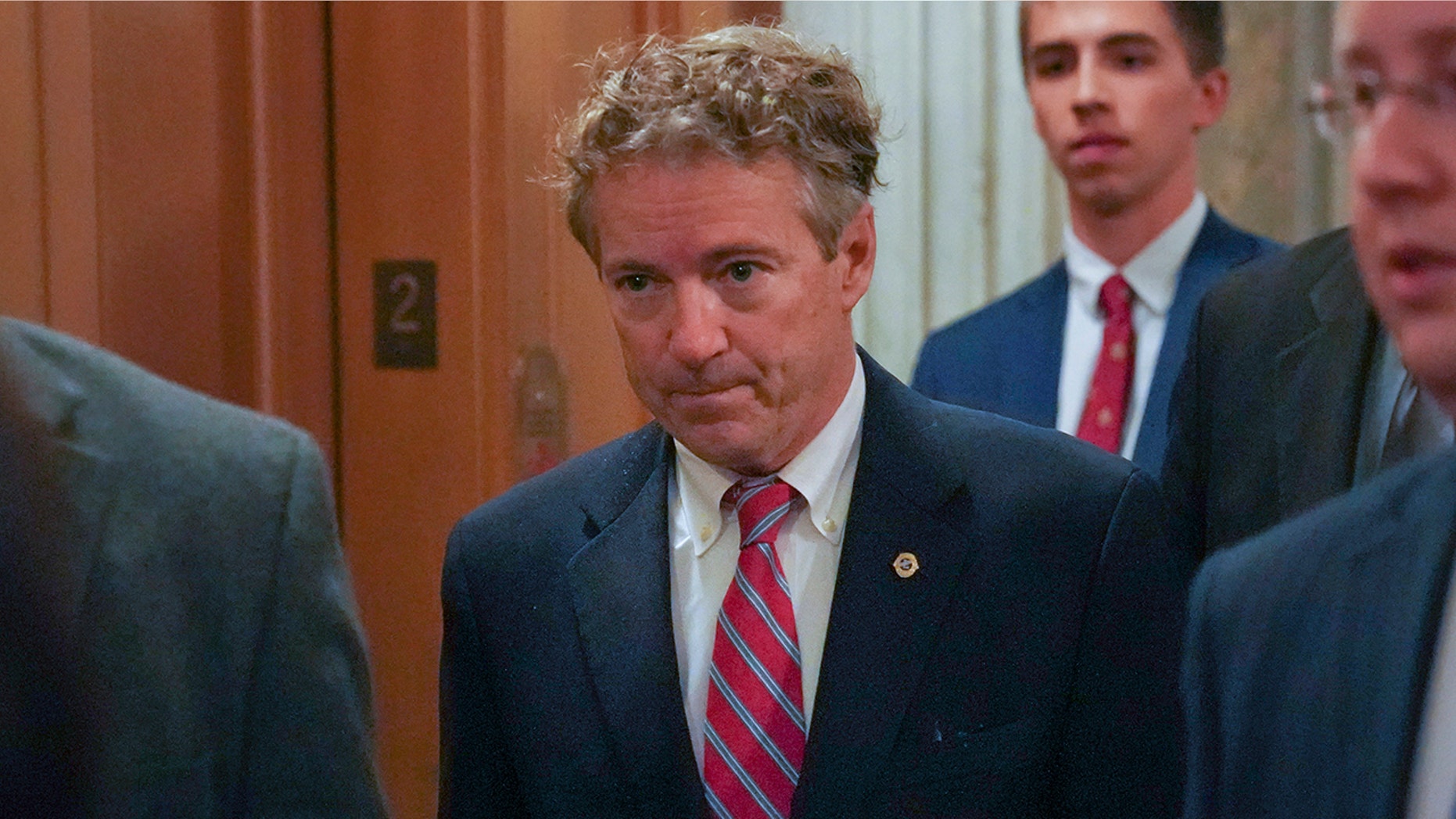 Sen. Rand Paul, R-Ky., arrives on Capitol Hill in Washington, Monday, Nov. 13, 2017. Paul entered the chamber, hands by his sides, to cast a vote.