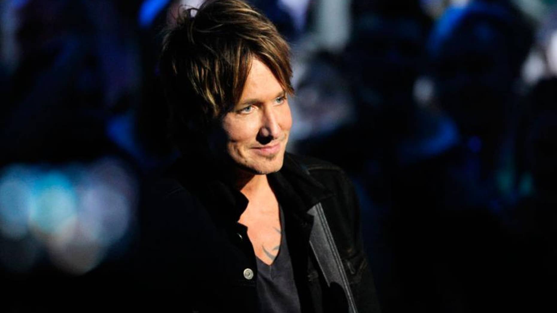 There's a reason (or three) why fans can't get enough of country star Keith Urban.