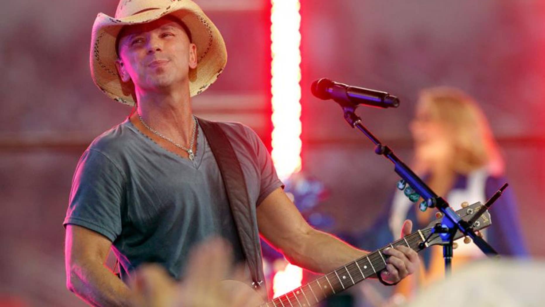 Kenny Chesney injured himself onstage during a concert in Kansas City.