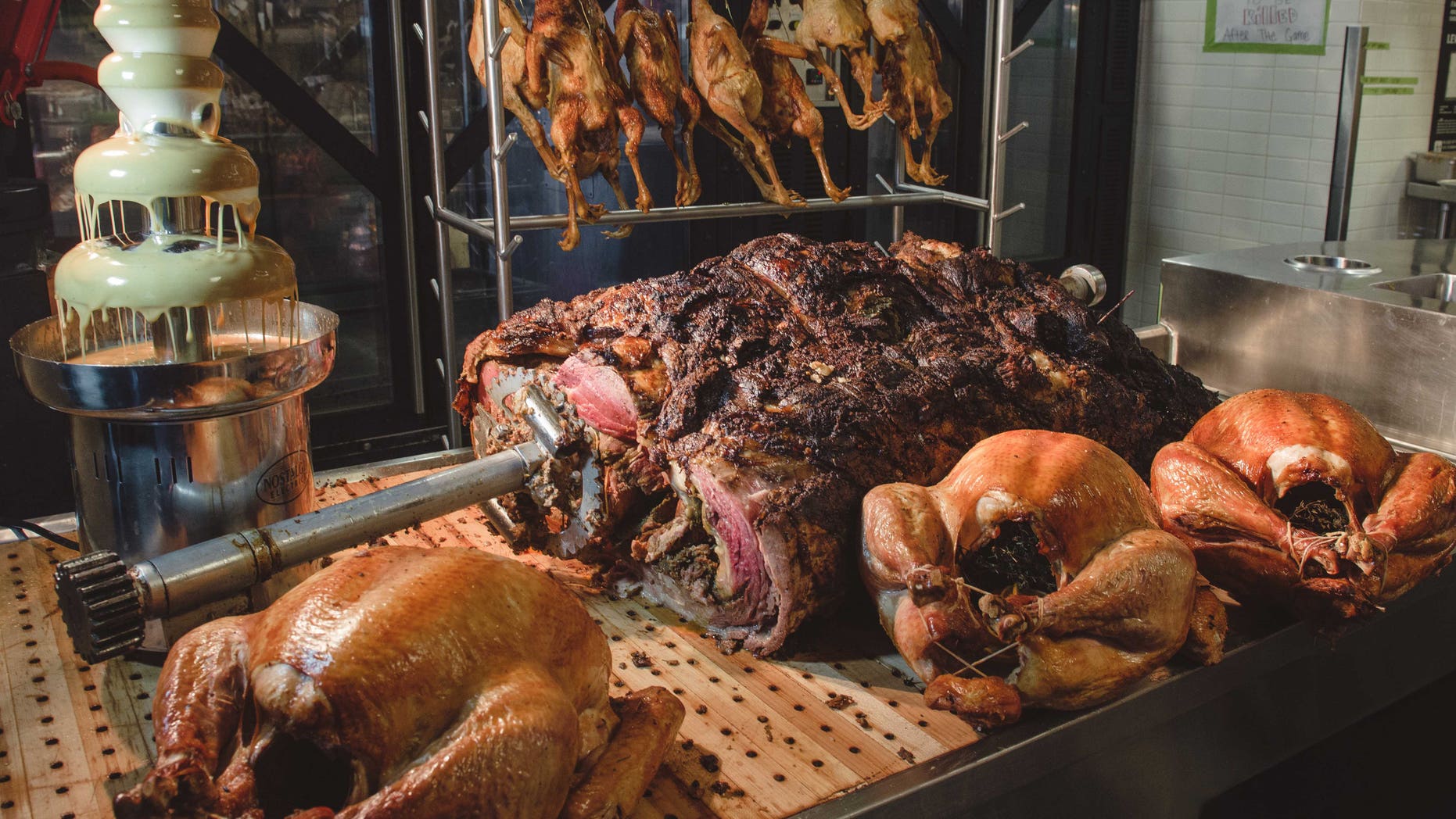 The massive roast is served at Bourboon Steak and Pub Tailgate party during San Francisco 49ers game versus the Seattle Seahawks on Thanksgiving Day.