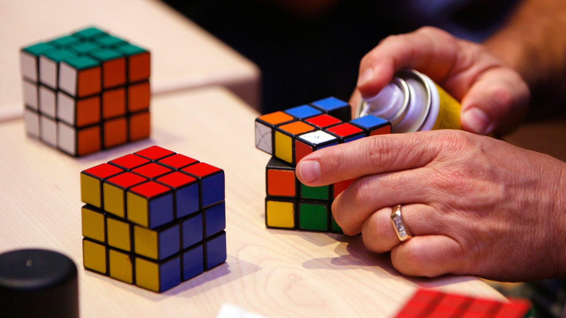 A competitor cleaning his Rubik's cube.