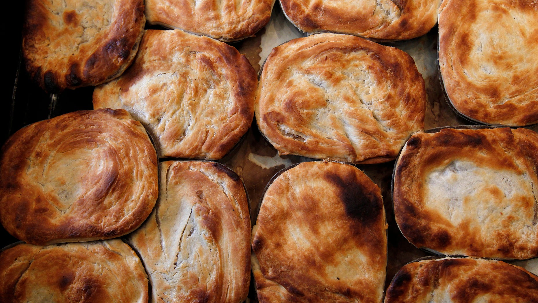 File photo: none of these pies were sent into space. These traditional British meat pies are pictured in G. Kelly's pie and mash shop in east London June 1, 2012. (REUTERS/Suzanne Plunkett)