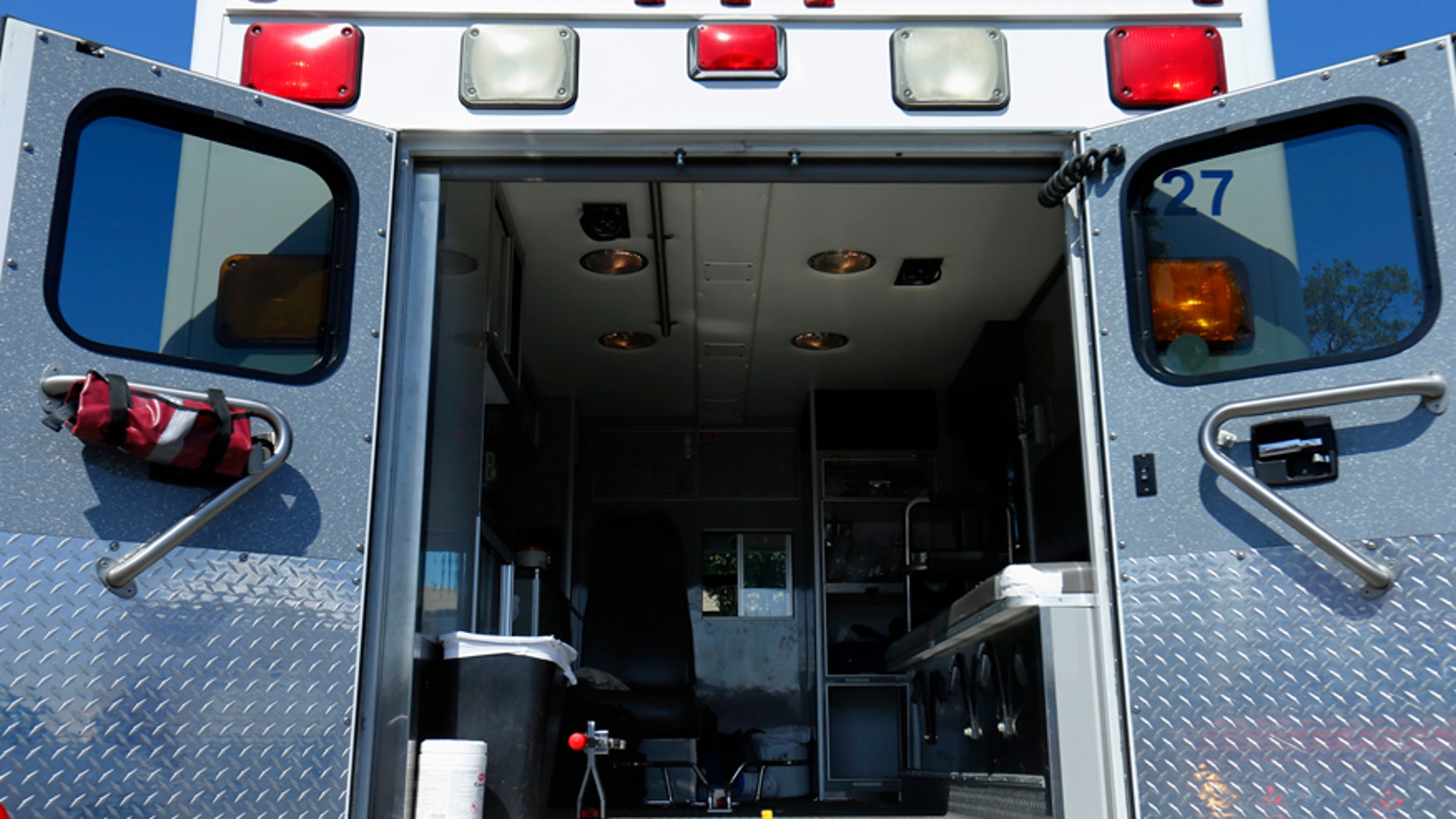 The back of an ambulance is shown during a mock rescue drill simulating a boating accident in waters off the coast of San Diego, California March 5, 2014. Lifeguards, police, fire and Coast Guard personnel joined together to assess their ability to respond and learn from the training exercise. REUTERS/Mike Blake (UNITED STATES - Tags: SOCIETY TRANSPORT) - RTR3G3M0
