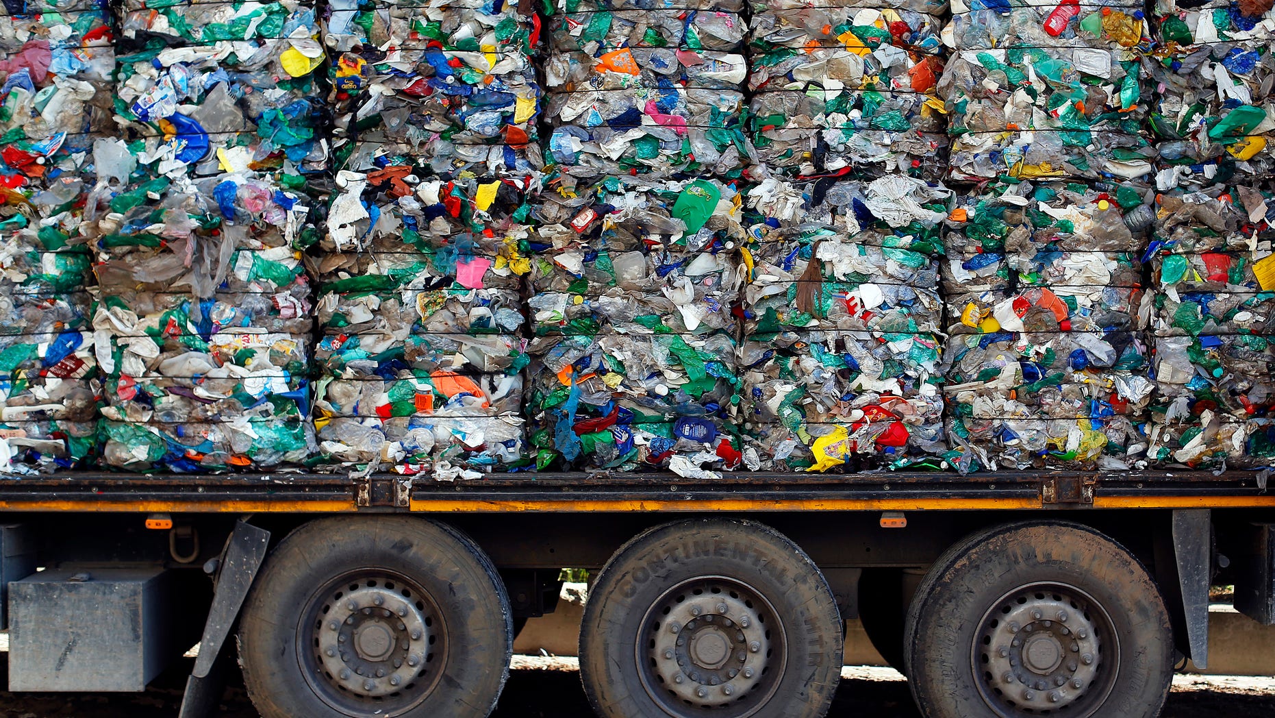 File photo: A truck loaded with waste is seen at the Malagrotta landfill near Rome, December 11, 2013.