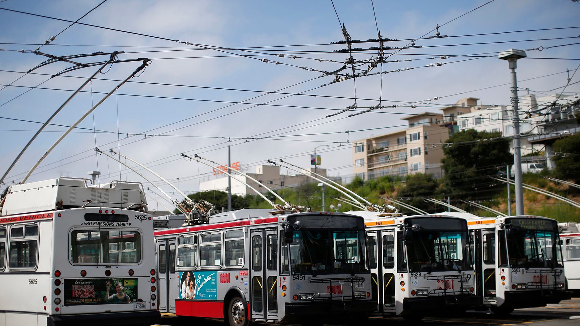 In this file photo, San Francisco Municipal Transit Agency buses are seen parked at the agency's Presidio Division office in San Francisco.