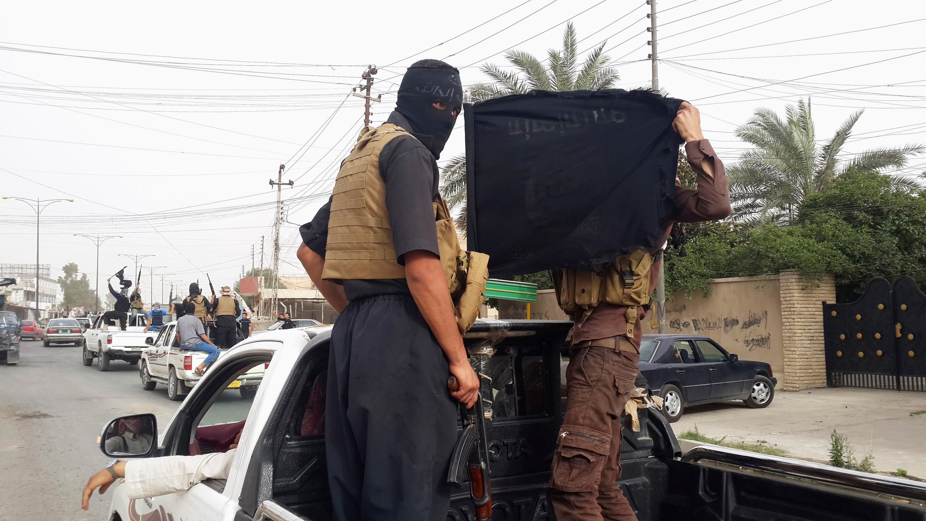 June 12, 2014: ISIS fighters in Mosul, Iraq. (Reuters)