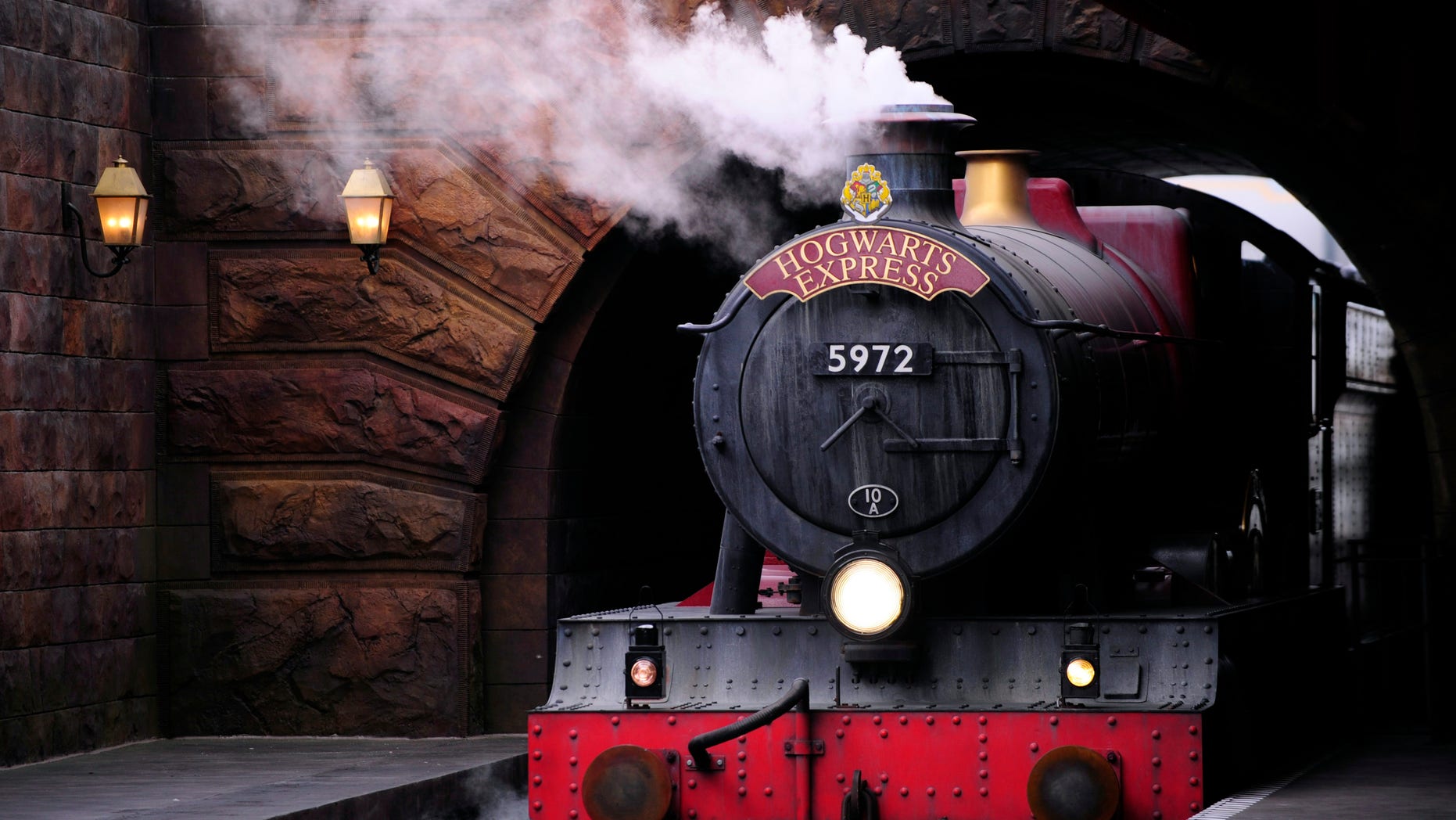 The Hogwarts Express train, which connects the Universal Studios with neighboring Islands of Adventure, pulls into the Hogsmeade Station during a media preview for The Wizarding World of Harry Potter-Diagon Alley at the Universal Orlando Resort in Orlando, Florida June 19, 2014.