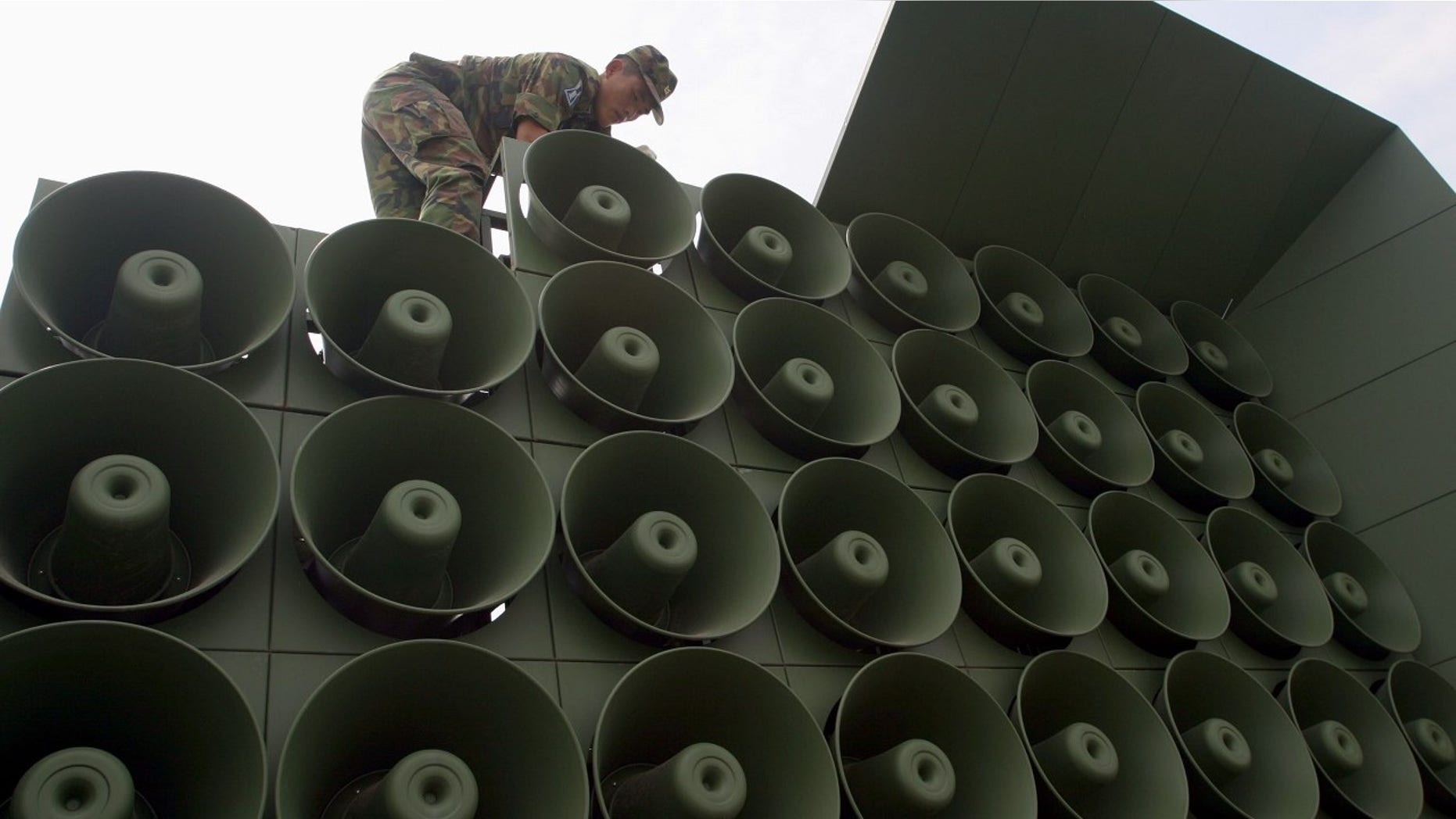 FILE 2014: A South Korean soldier works to remove loudspeakers set up for propaganda purposes near the demiltarized zone in Paju, which is north of Seoul.