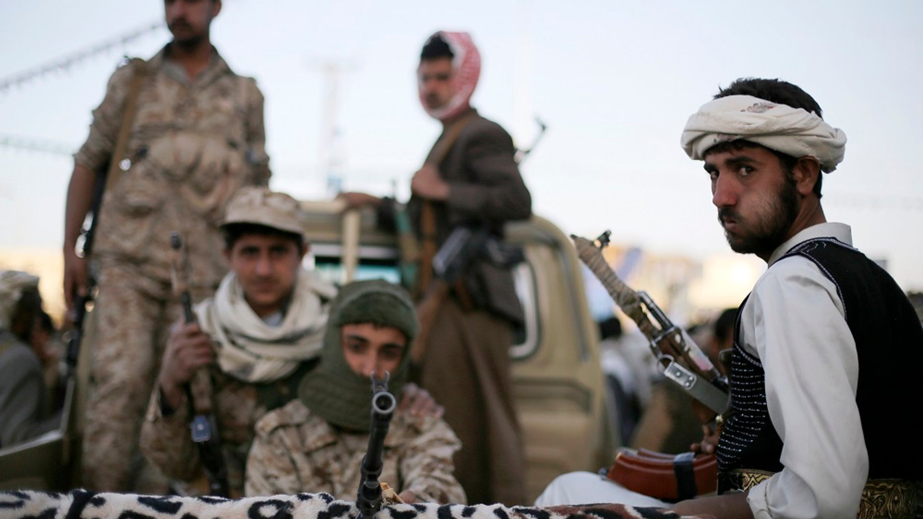 In this January 2015 photo, Houthi fighters patrol a road in Yemen's capital Sana'a. After the group took over the capital in September 2014, a Saudi-led coalition, backed by the U.S., intervened on behalf of the Yemini government.