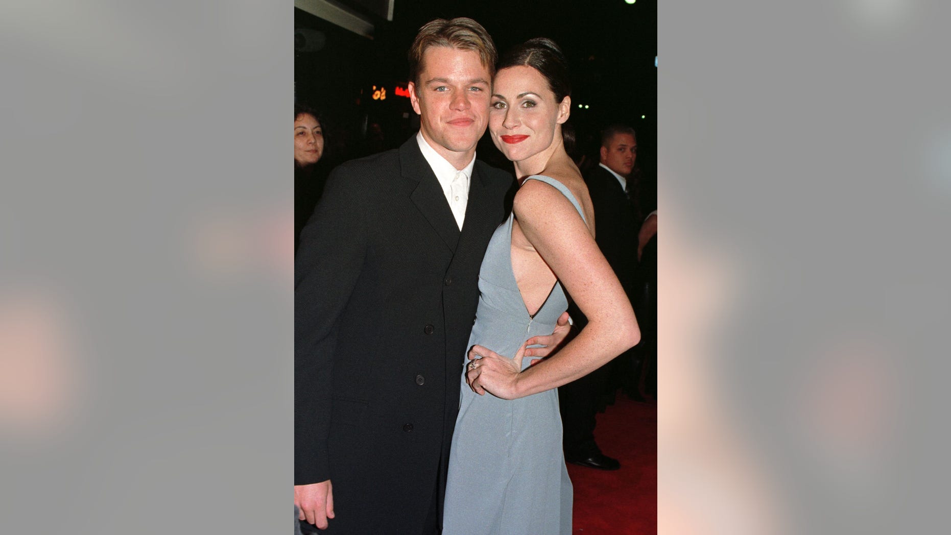 Actors Matt Damon and Minnie Driver, stars of the new film "Good Will Hunting" pose together as they arrive for the film's premiere December 2, 1997 in Los Angeles.