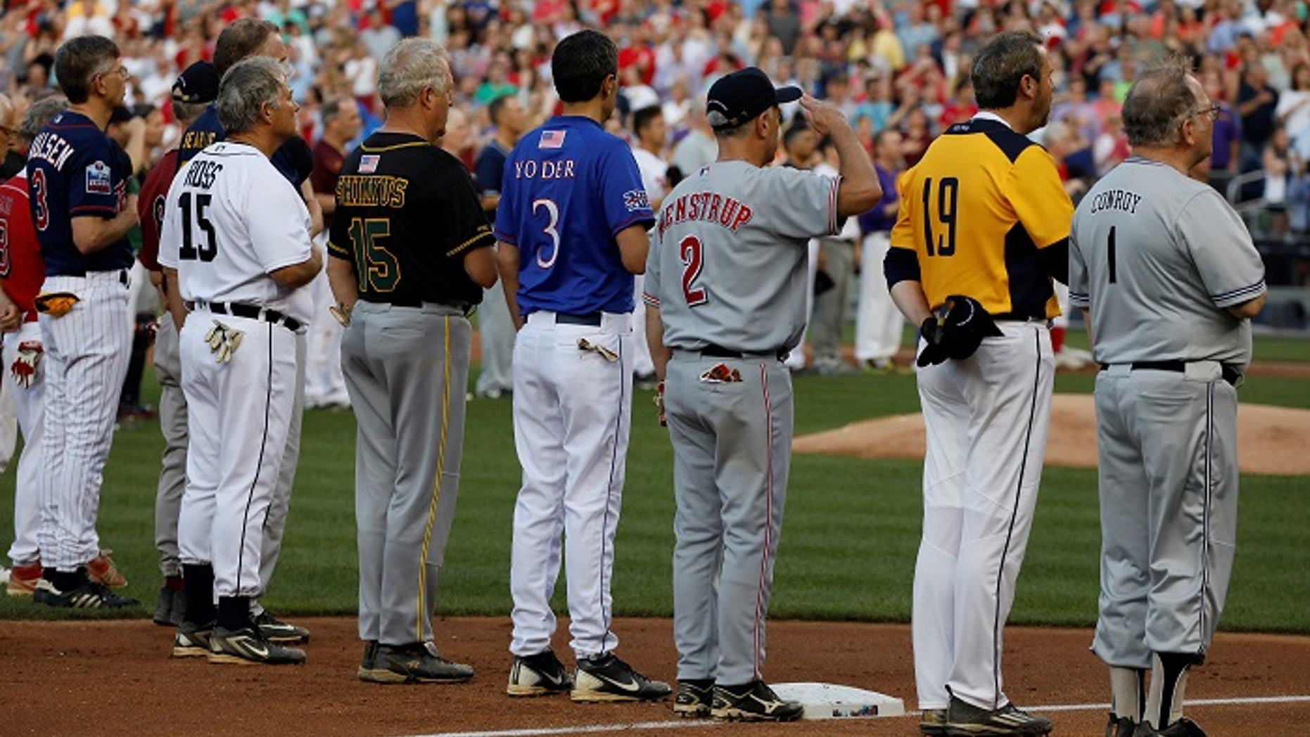 Members of the Congressional baseball teams stand for the National Anthem during the Congressional Baseball Game at Nationals Park in Washington, U.S., June 15, 2017.
