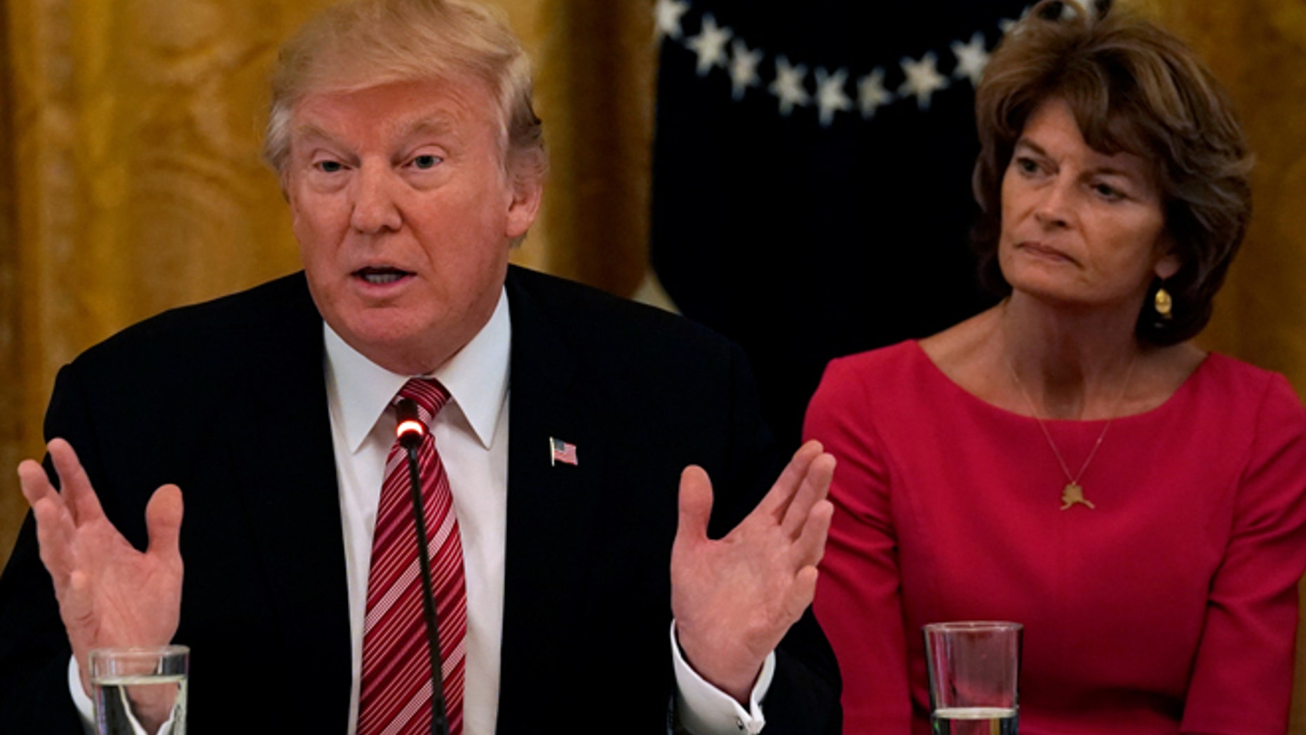 President Trump with Alaska Sen. Lisa Murkowski in June. Fellow Alaska Sen. Dan Sullivan said he and Murkowski told Trump not to rename Denali.
