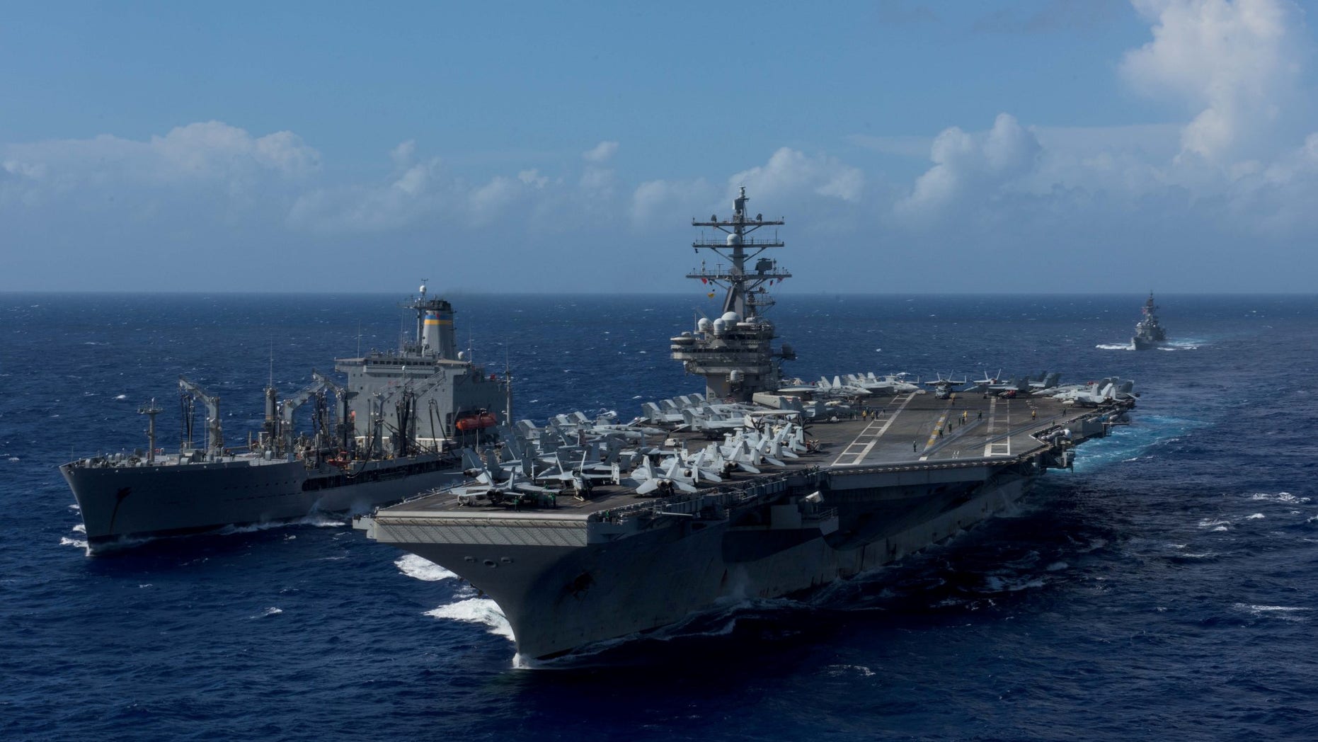 FILE -- U.S. Navy's forward-deployed aircraft carrier USS Ronald Reagan is seen during a replenishment-at-sea with the Military Sealift Command's fleet replenishment oiler USNS John Ericsson in waters around Okinawa southwest of the Korean peninsula, October 9, 2017.