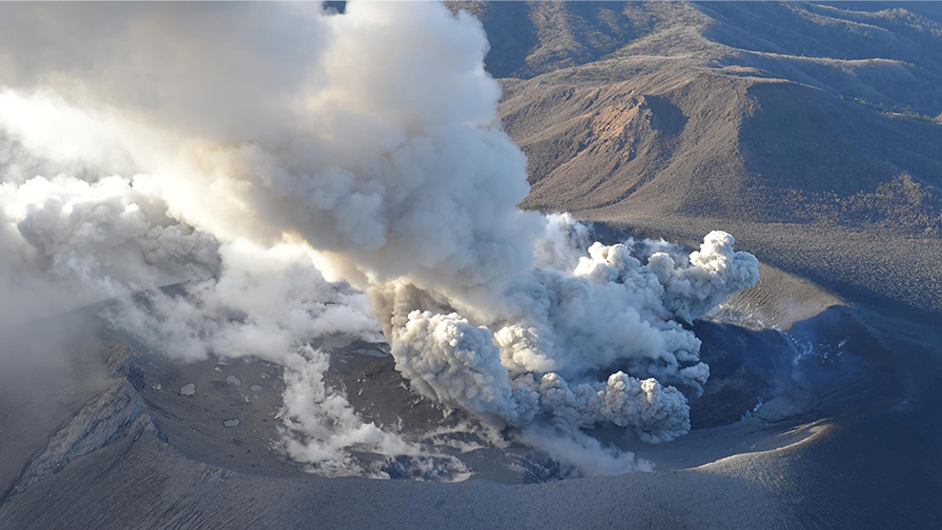 An aerial view shows Shinmoedake peak erupting between Miyazaki and Kagoshima prefectures, southwestern Japan.