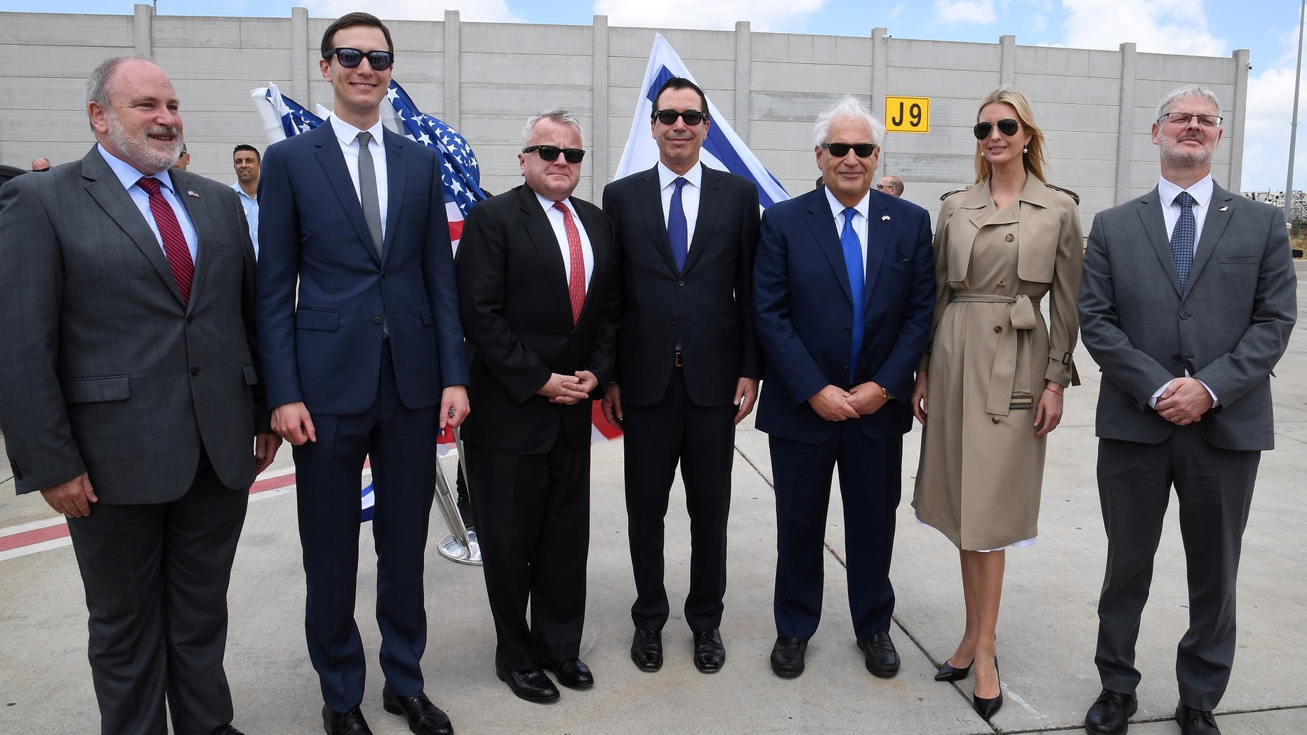 White House senior advisor Ivanka Trump (2nd-R), U.S. Ambassador to Israel David Friedman (3rd-R), U.S. Treasury Secretary Steven Mnuchin (C), U.S. Deputy Secretary of State John Sullivan (3rd-L), White House Senior Advisor Jared Kushner (2nd-L) and Israeli officials pose for a photo before the opening of the new U.S. embassy in Jerusalem.