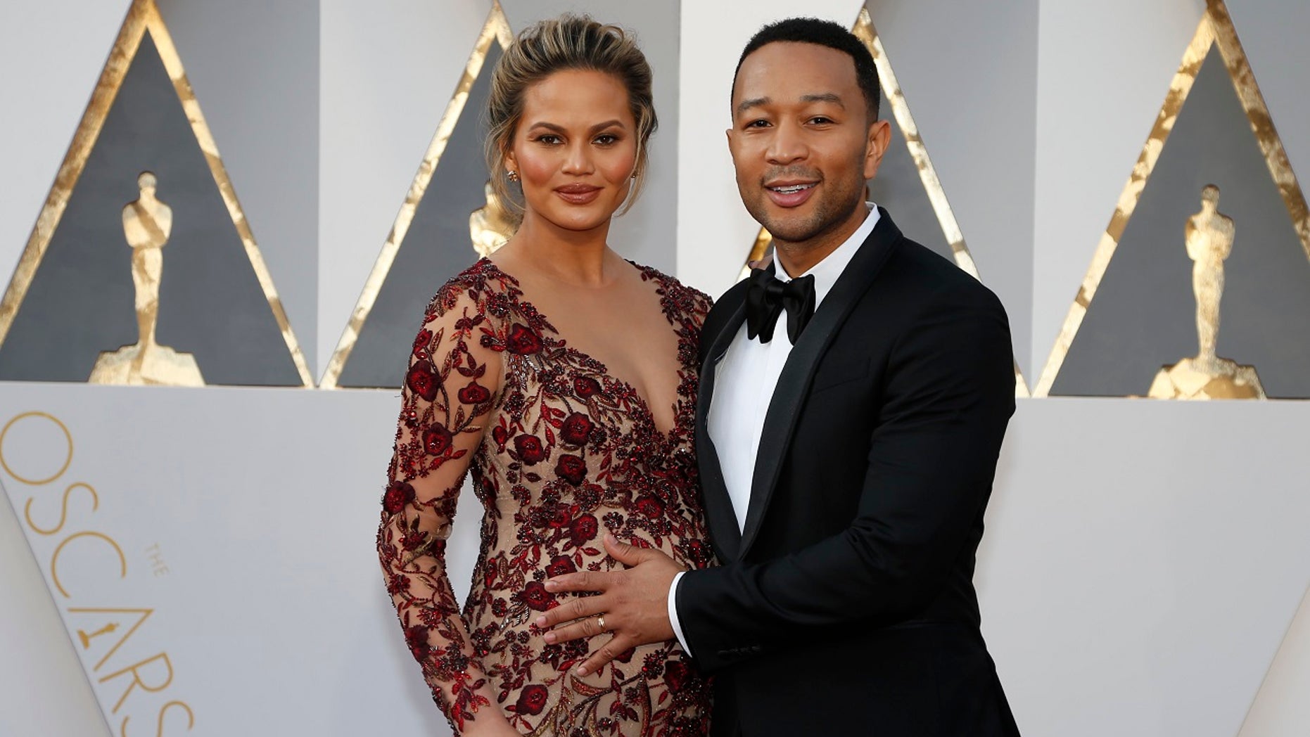Model Chrissy Teigen and singer John Legend arrive at the 88th Academy Awards in Hollywood, Calif., Feb. 28, 2016. The couple welcomed a baby boy Wednesday.