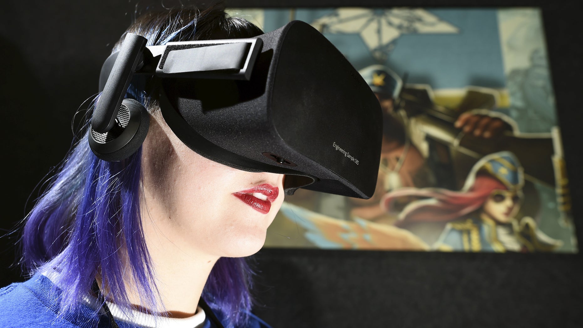 Kaitlyn Innis, a brand ambassador for Oculus, plays "Dragon Front" by High Voltage Software during the Oculus Game Day VR event in San Francisco, California March 15, 2016. REUTERS/Noah Berger - RTSARMX