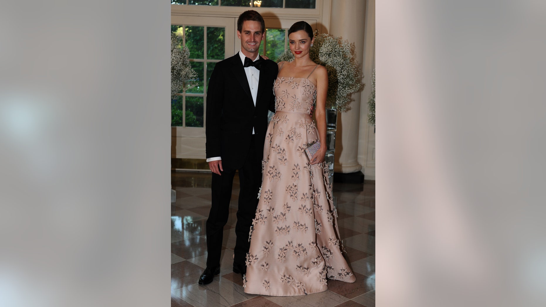 Evan Spiegel, Chief Executive Officer, Snapchat and model Miranda Kerr arrive for the state dinner in honor of the Nordic Summit at the White House in Washington, May 13, 2016. REUTERS/Mary F. Calvert - RTSE8TG