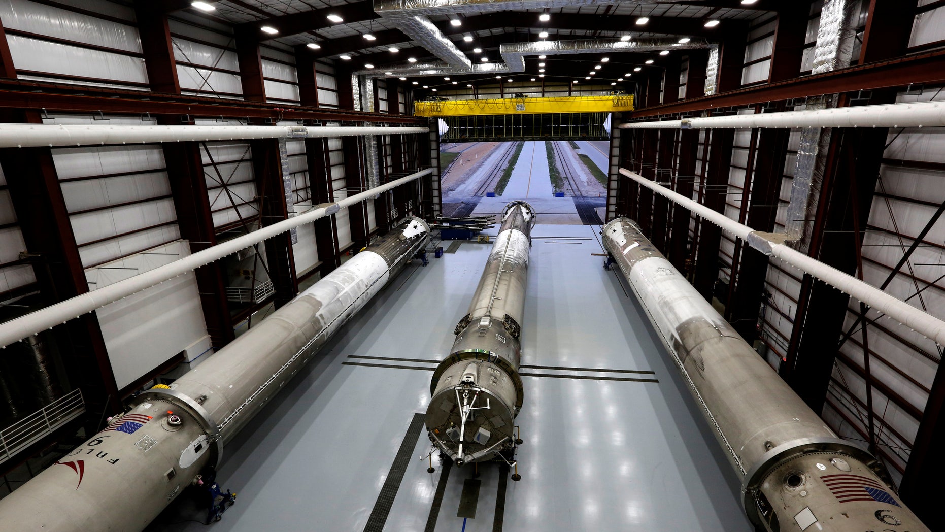 Recovered first stages of three SpaceX Falcon 9 rocket are shown during a photo opportunity in the SpaceX hangar at launch pad 39A at the Kennedy Space Center in Cape Canaveral, Florida May 14, 2016.