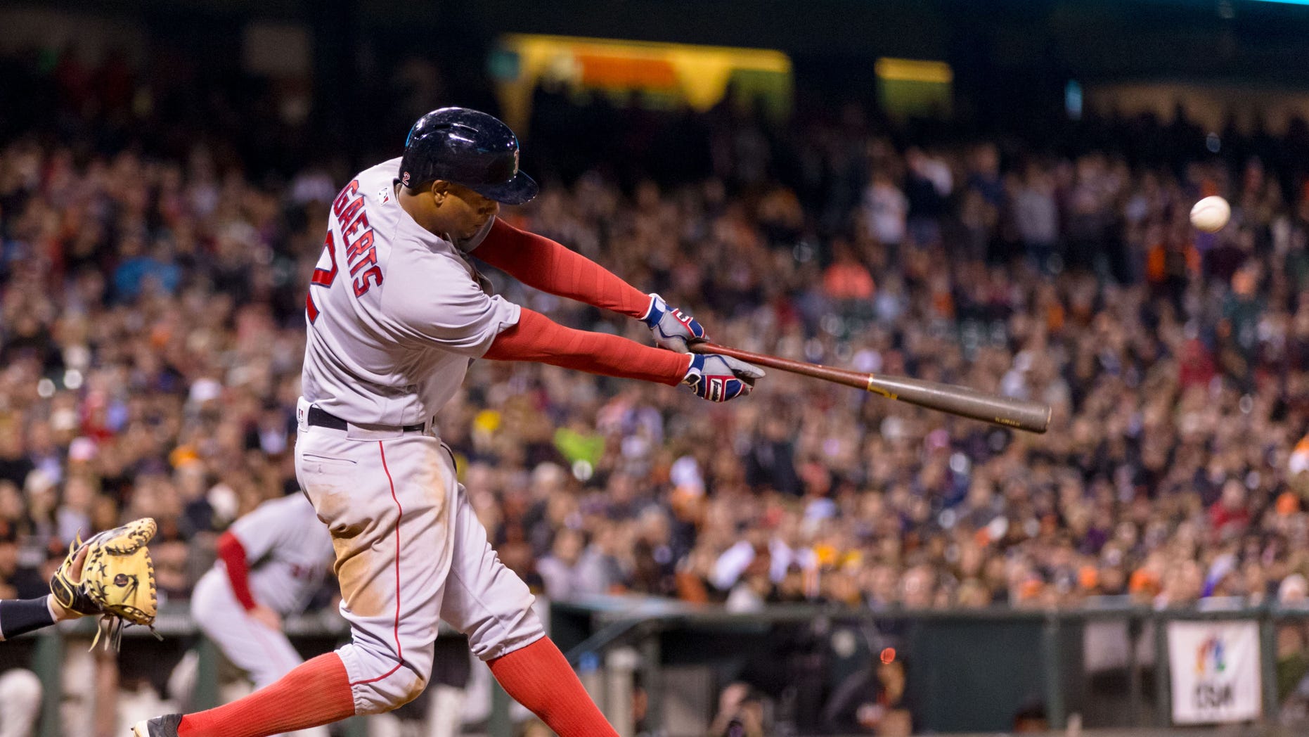 Boston Red Sox shortstop Xander Bogaerts (2) hits a two run single against the San Francisco Giants in the tenth inning at AT&T Park on Jun 7, 2016.