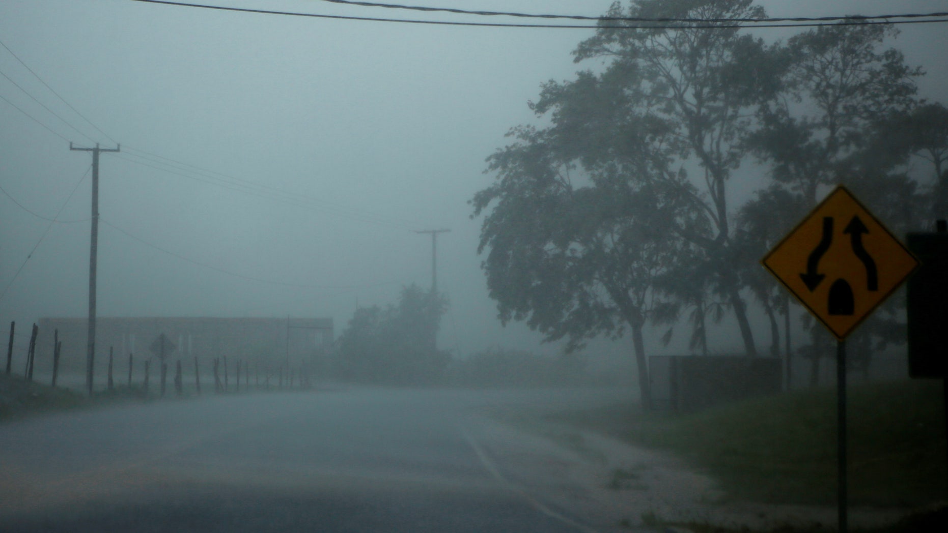 Heavy rain pictured through the windshield of a car as Hurricane Earl approaches, in Belize City.