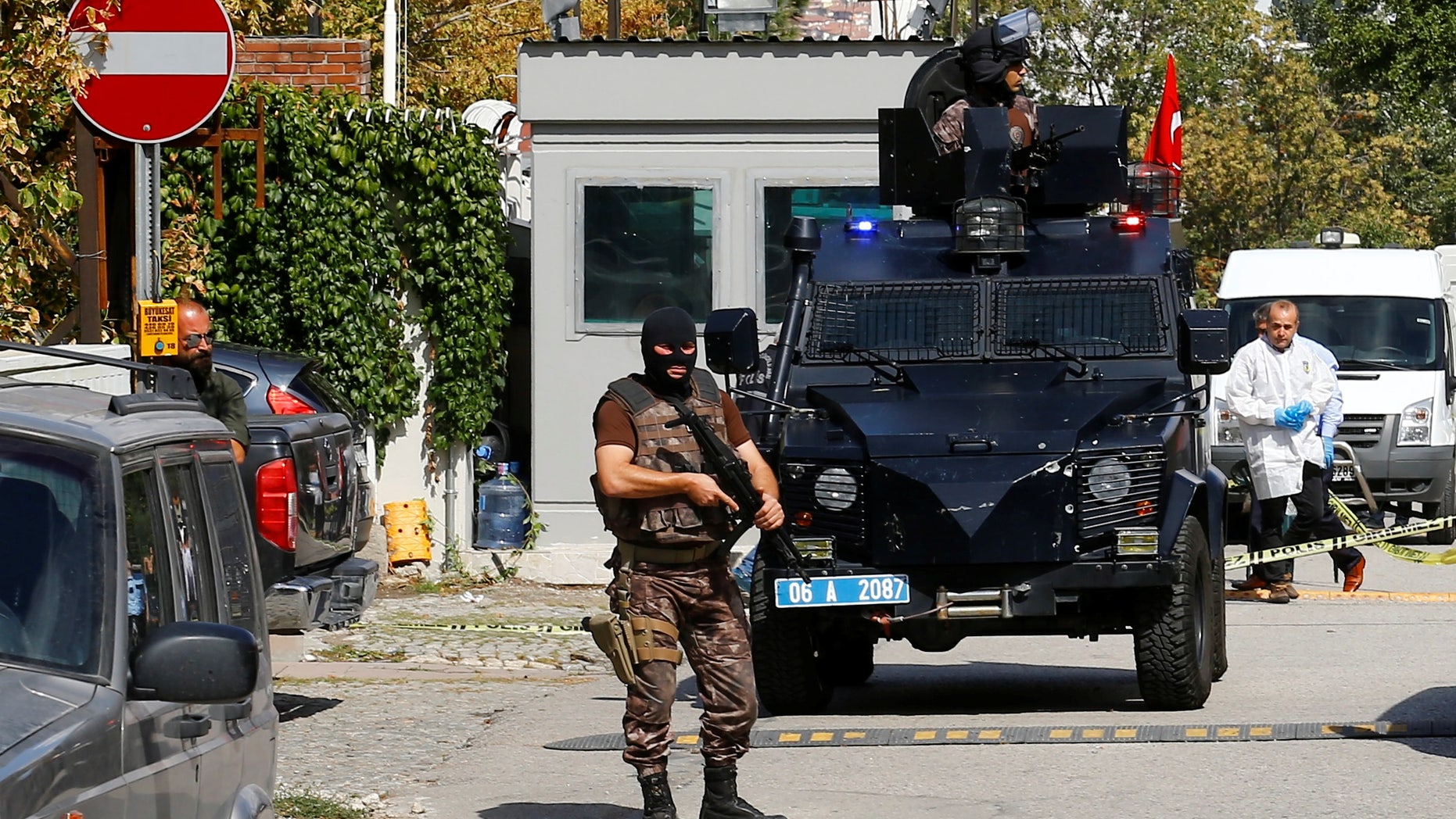 A member of police special forces stands guard in front of the Israeli Embassy in Ankara.