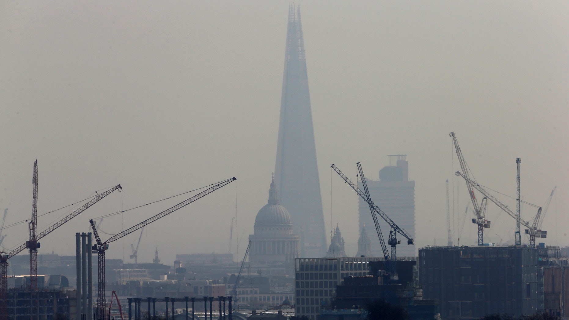 Smog surrounds The Shard and St Paul's Cathedral in London, Britain, April 3, 2014.