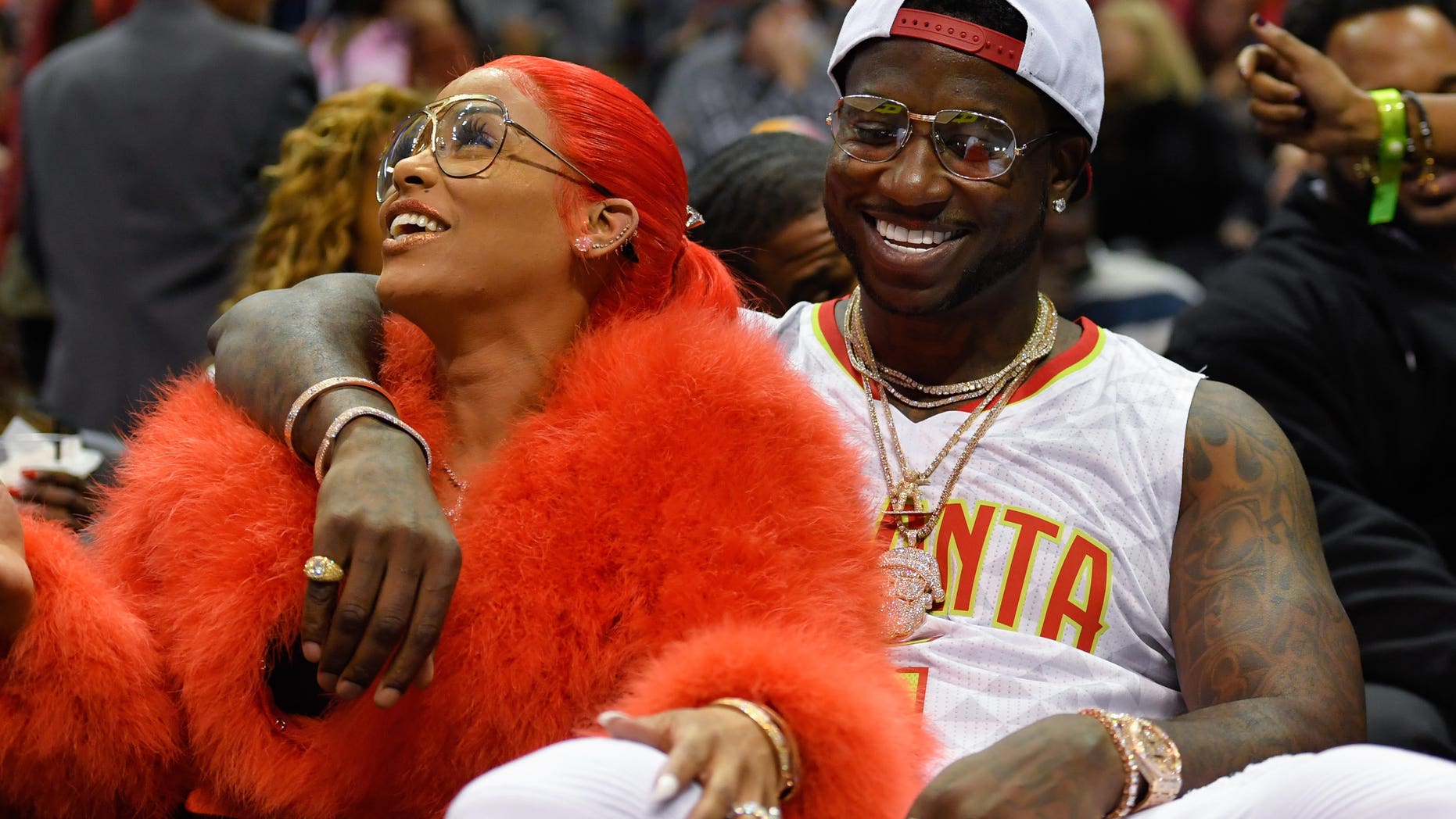 Nov 22, 2016; Atlanta, GA, USA; Recording artist Gucci Mane reacts with Keyshia Ka'oir after being engaged during a time out during the New Orleans Pelicans and Atlanta Hawks game during the second half at Philips Arena. The Pelicans defeated the Hawks 112-96.Mandatory Credit: Dale Zanine-USA TODAY Sports - RTSSVUQ